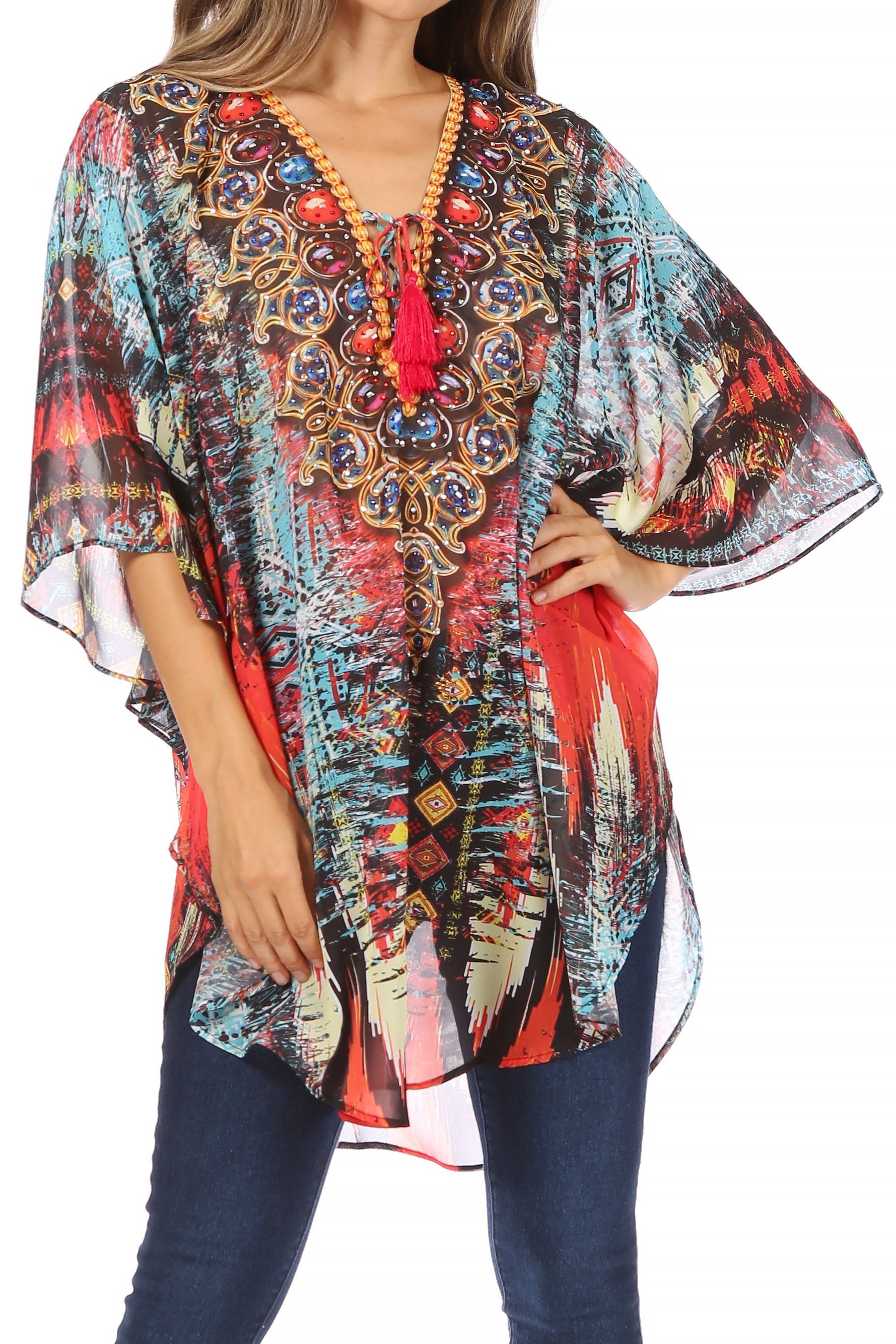 Colorful patterned top with a red accent worn by a person on a white background