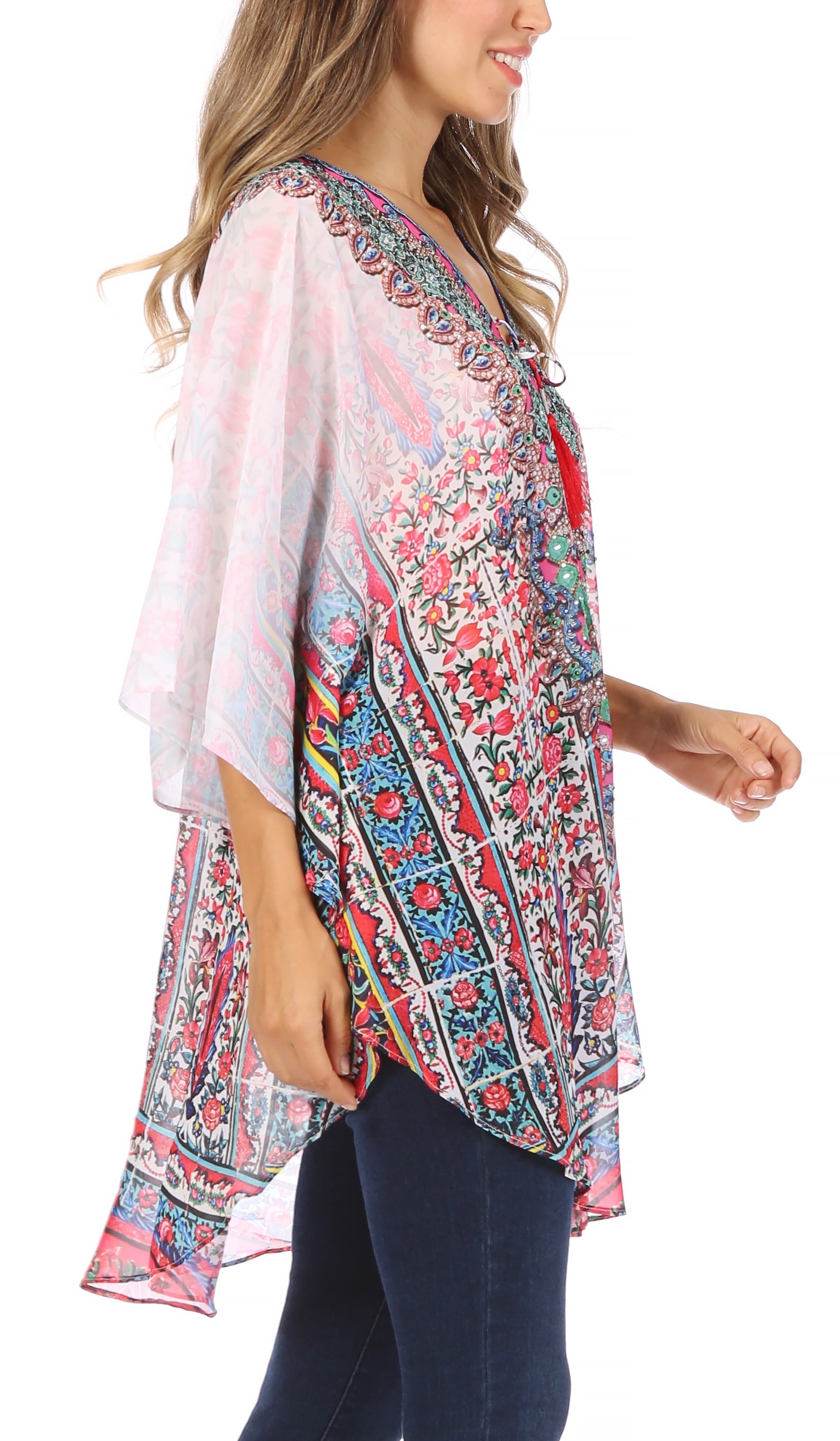 Woman wearing a colorful floral kimono-style top on a white background
