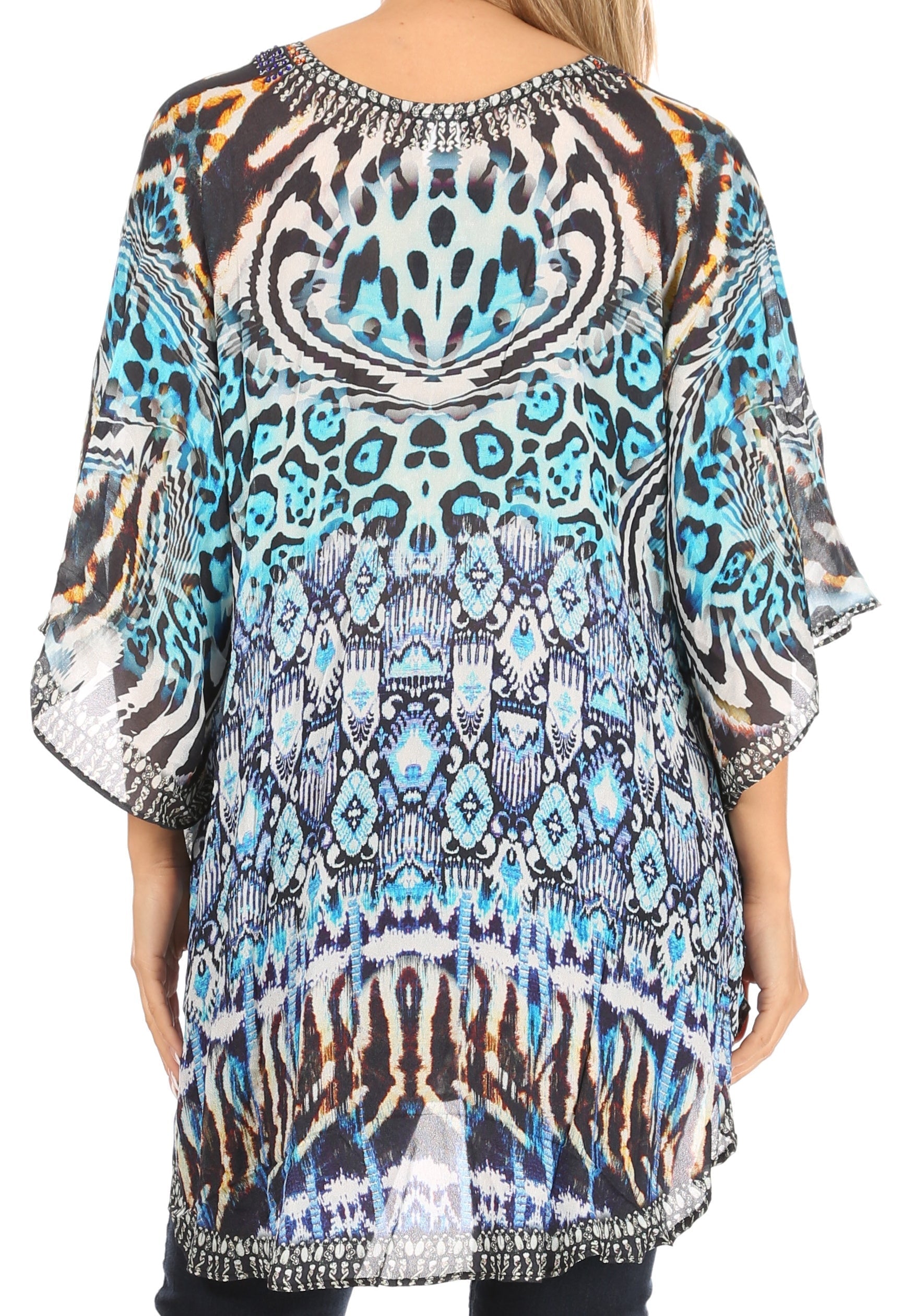 Multicolored patterned top worn by a person on a white background