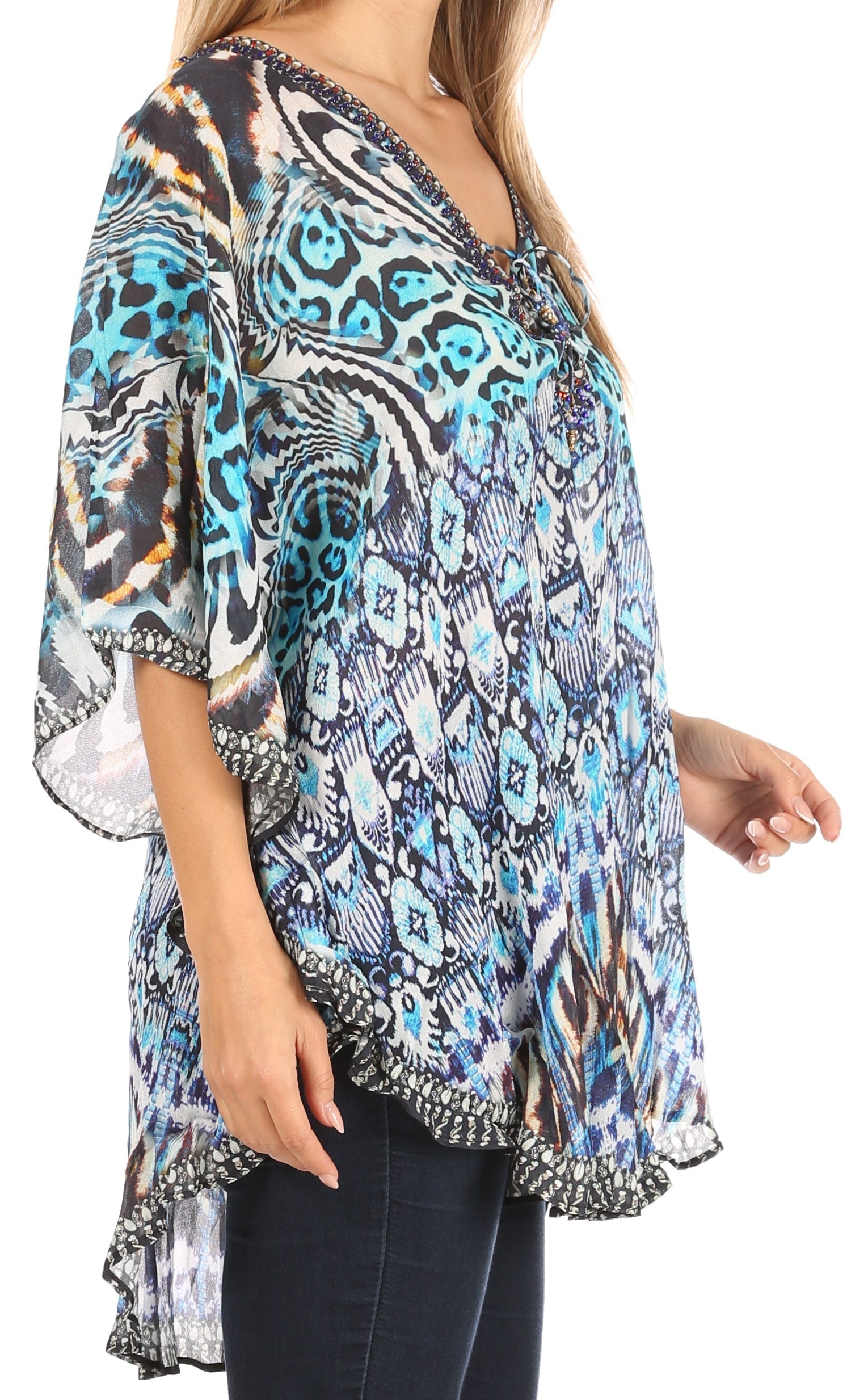 Woman wearing a patterned kimono-style top on a white background