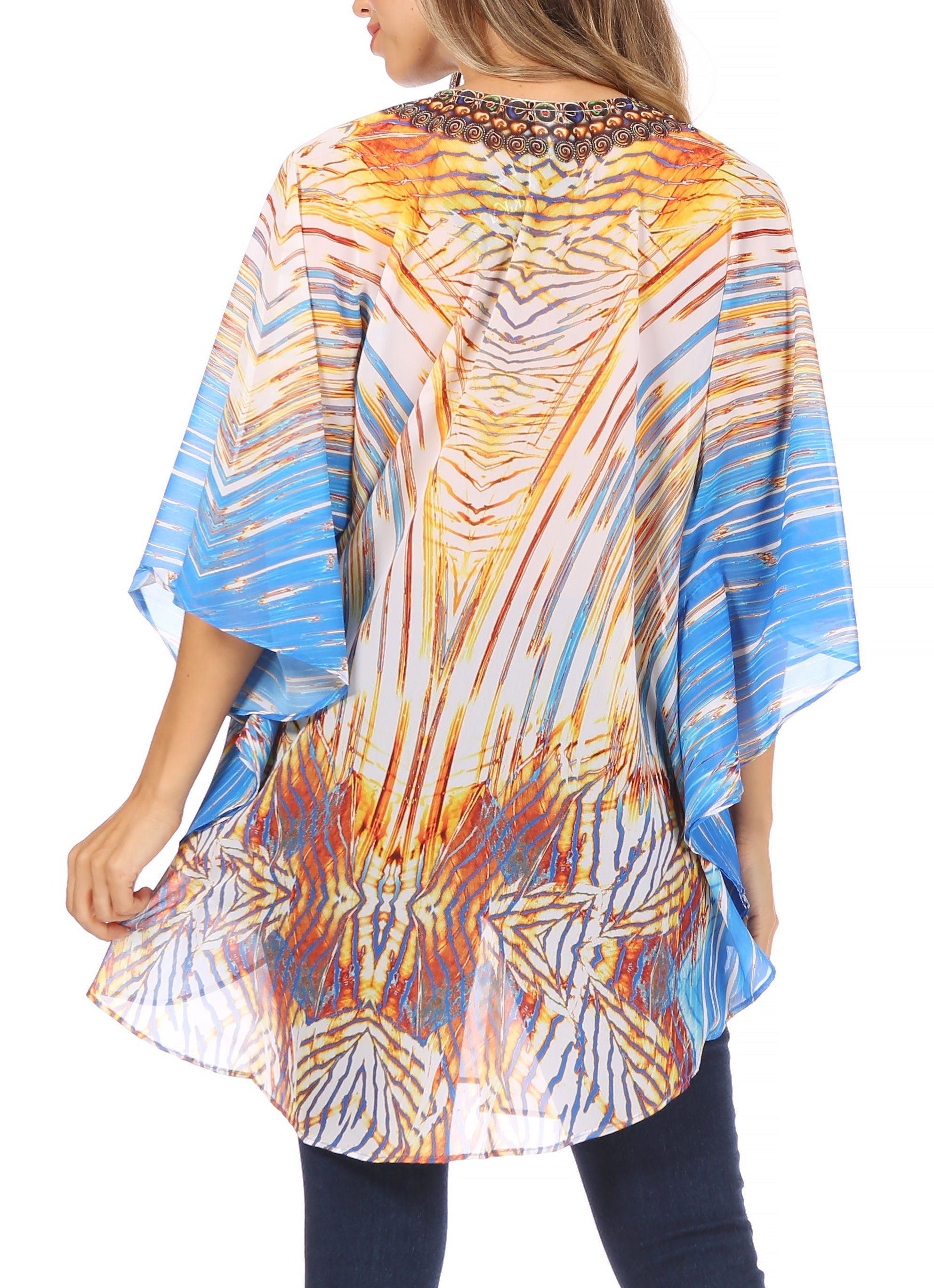 Woman wearing a colorful patterned kimono-style top on a white background