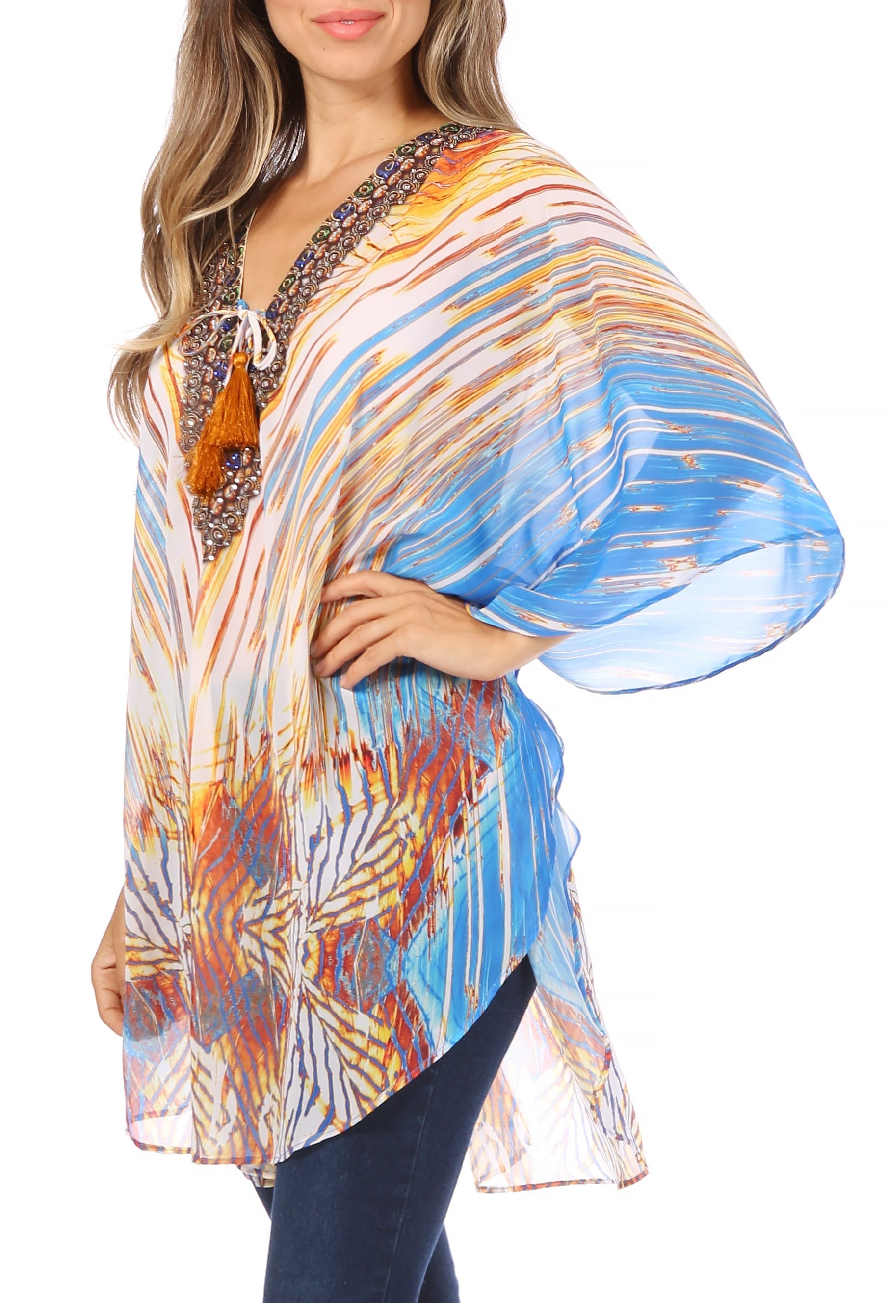 Woman wearing a colorful patterned blouse with a white background