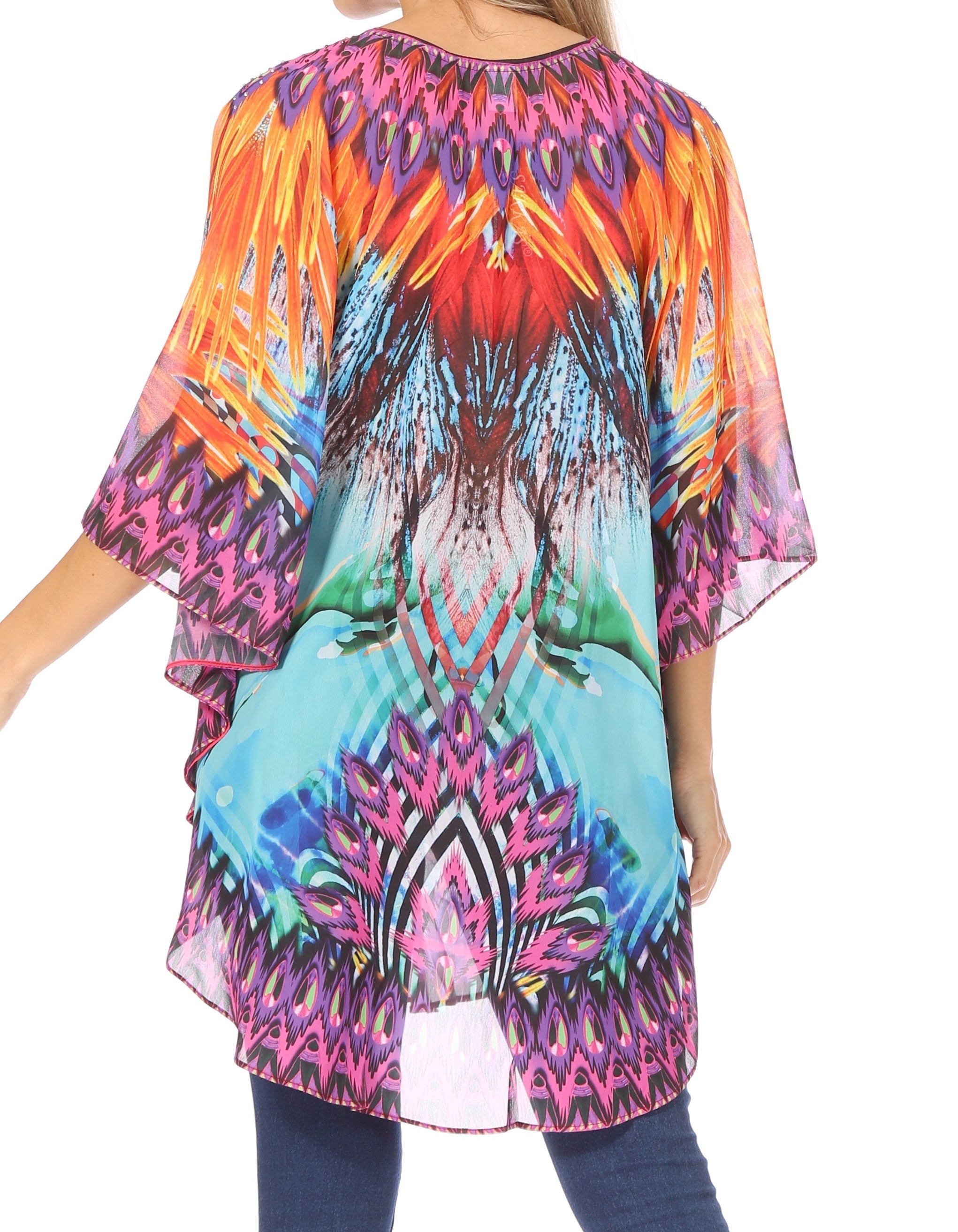 Colorful patterned top worn by a person on a white background