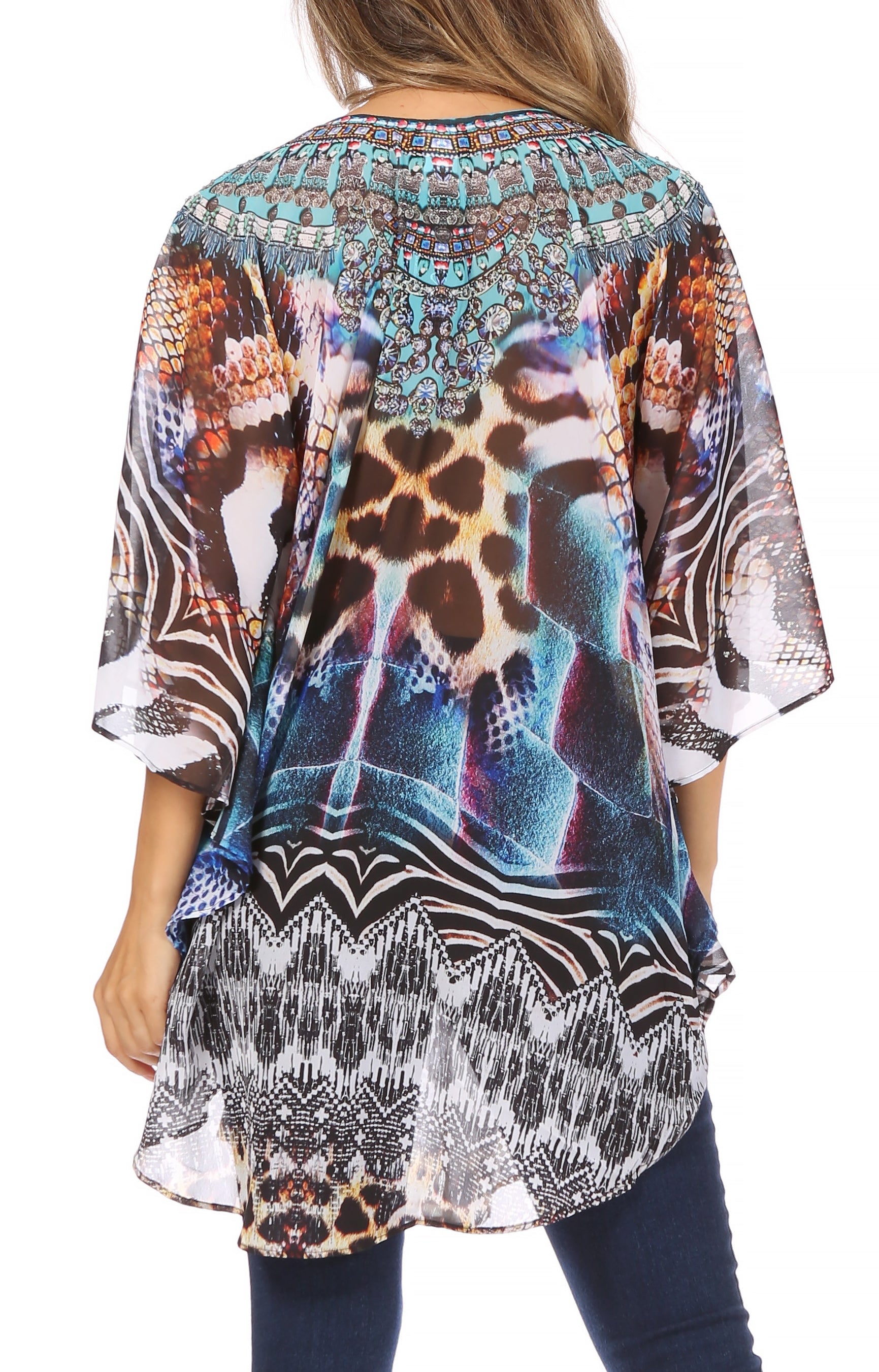 Multicolored patterned kimono-style top worn by a person on a white background