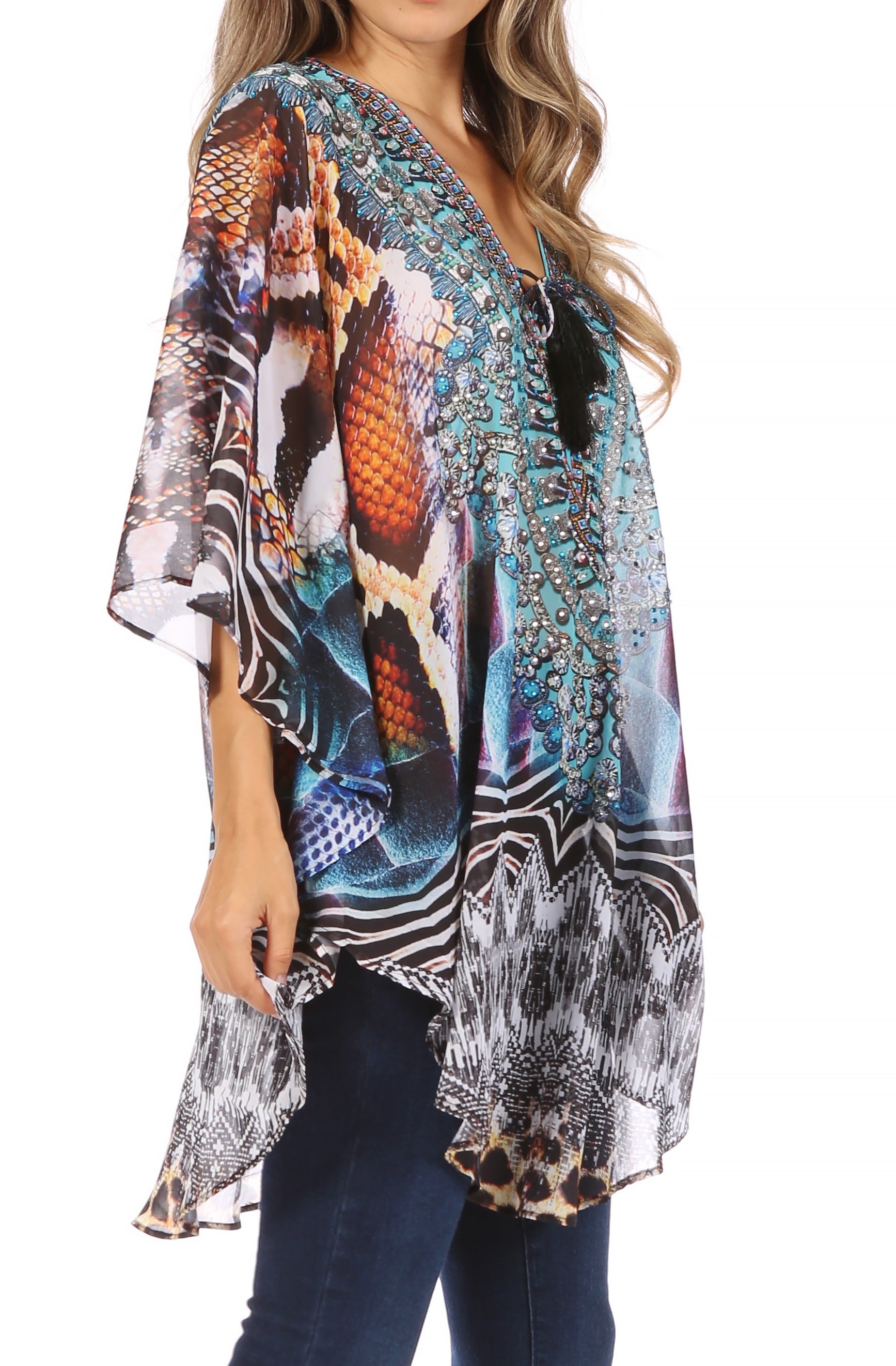 Woman wearing a colorful patterned blouse with a white background
