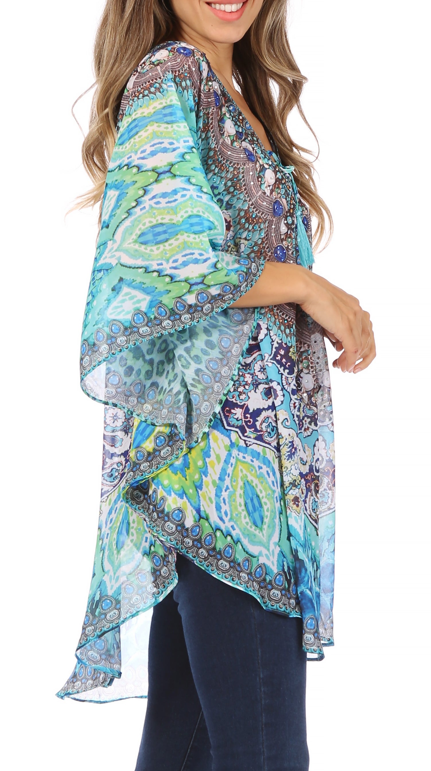 Woman wearing a colorful patterned kimono-style top on a white background
