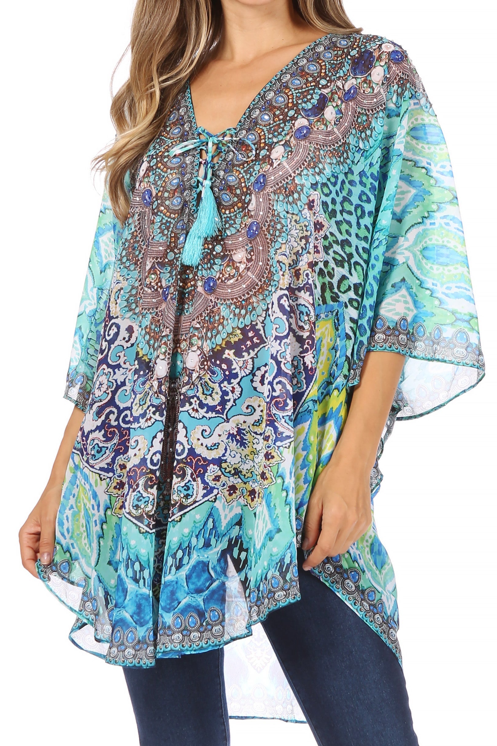 Woman wearing a colorful patterned blouse with a white background