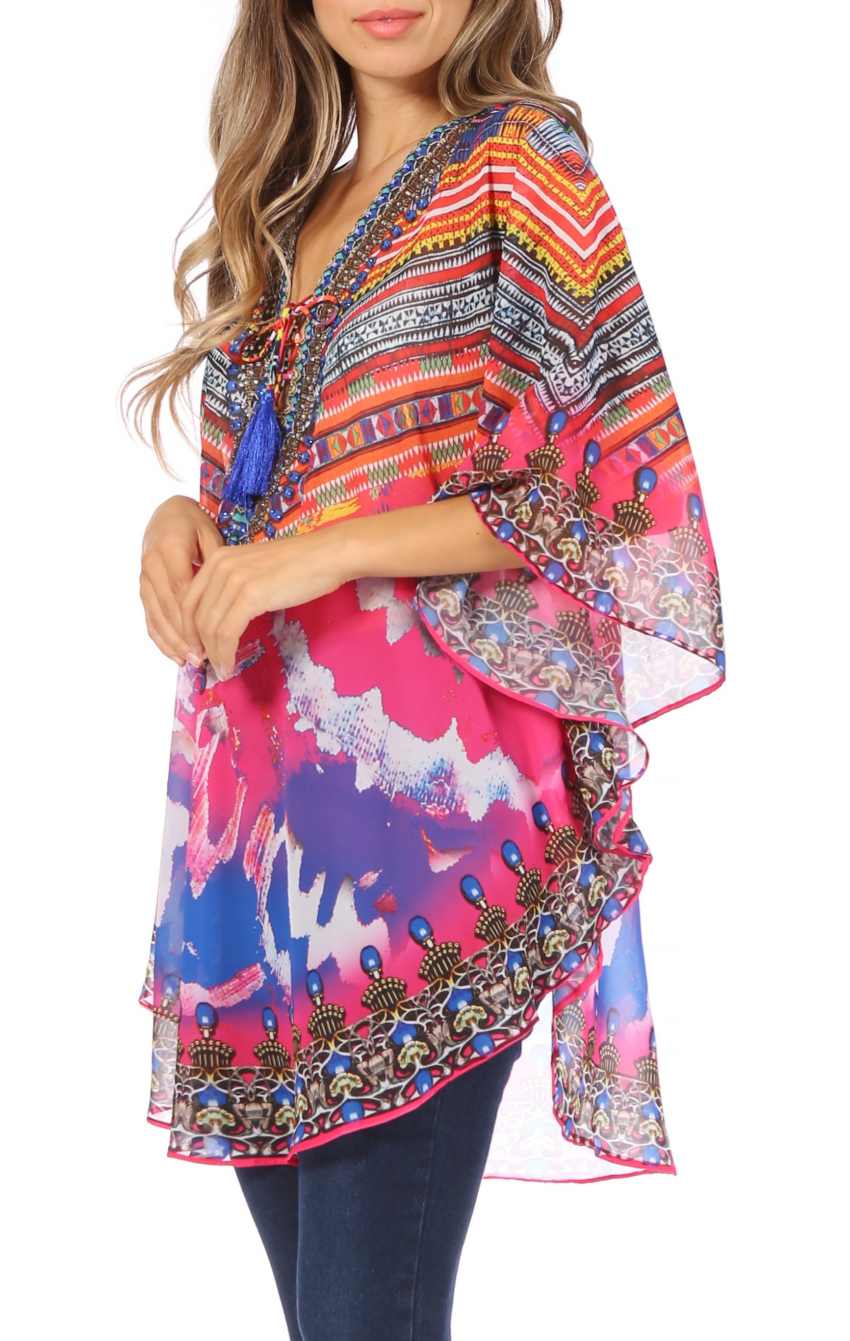 Woman wearing a colorful patterned kimono-style top on a white background