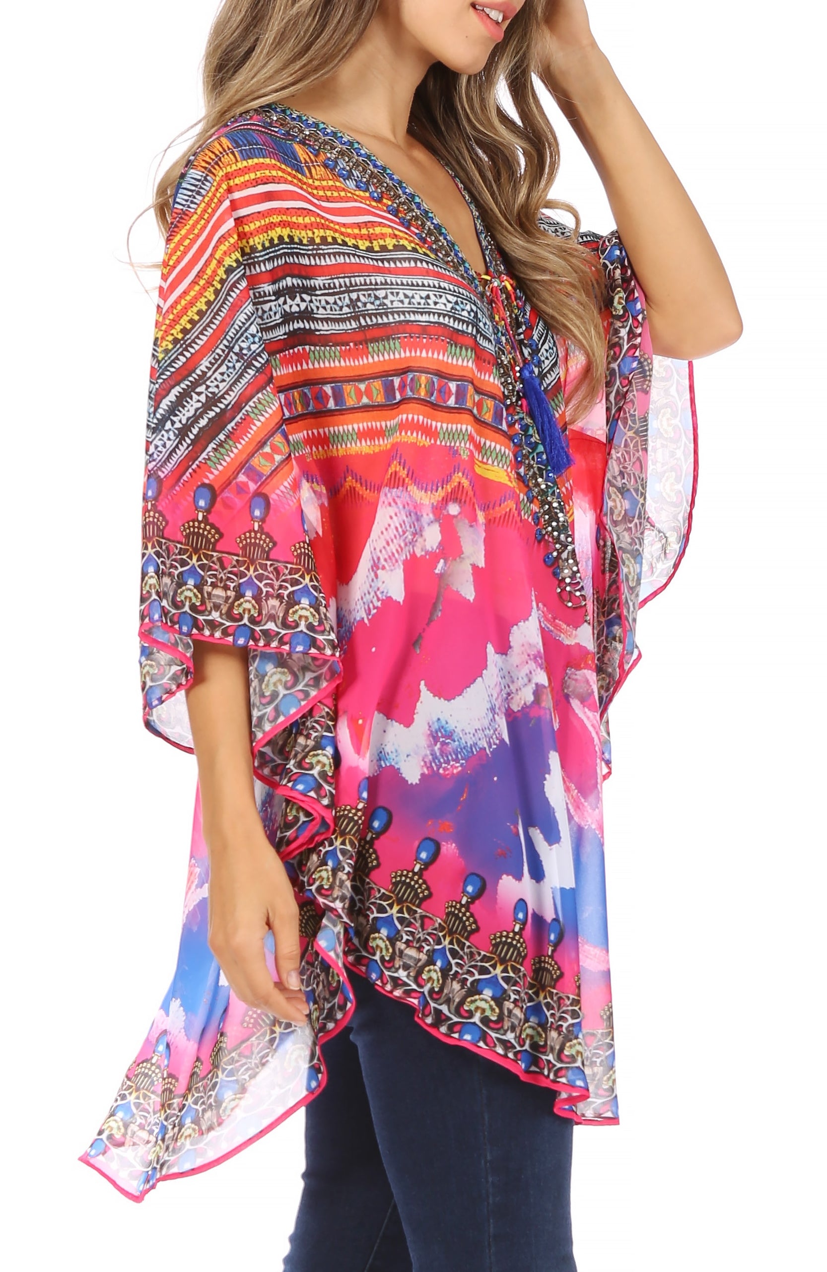 Woman wearing a colorful patterned blouse with a white background