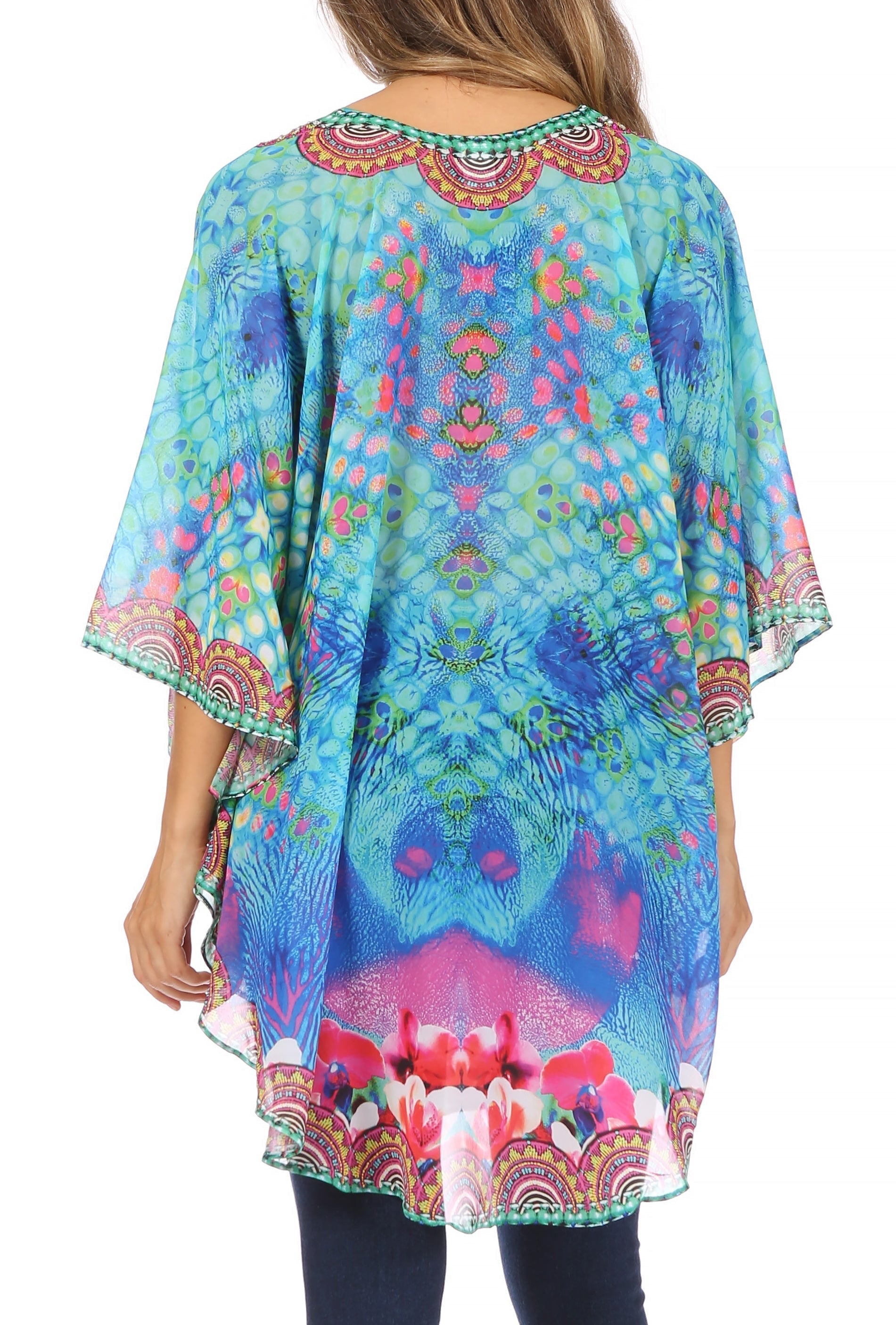 Colorful patterned kaftan worn by a person on a white background