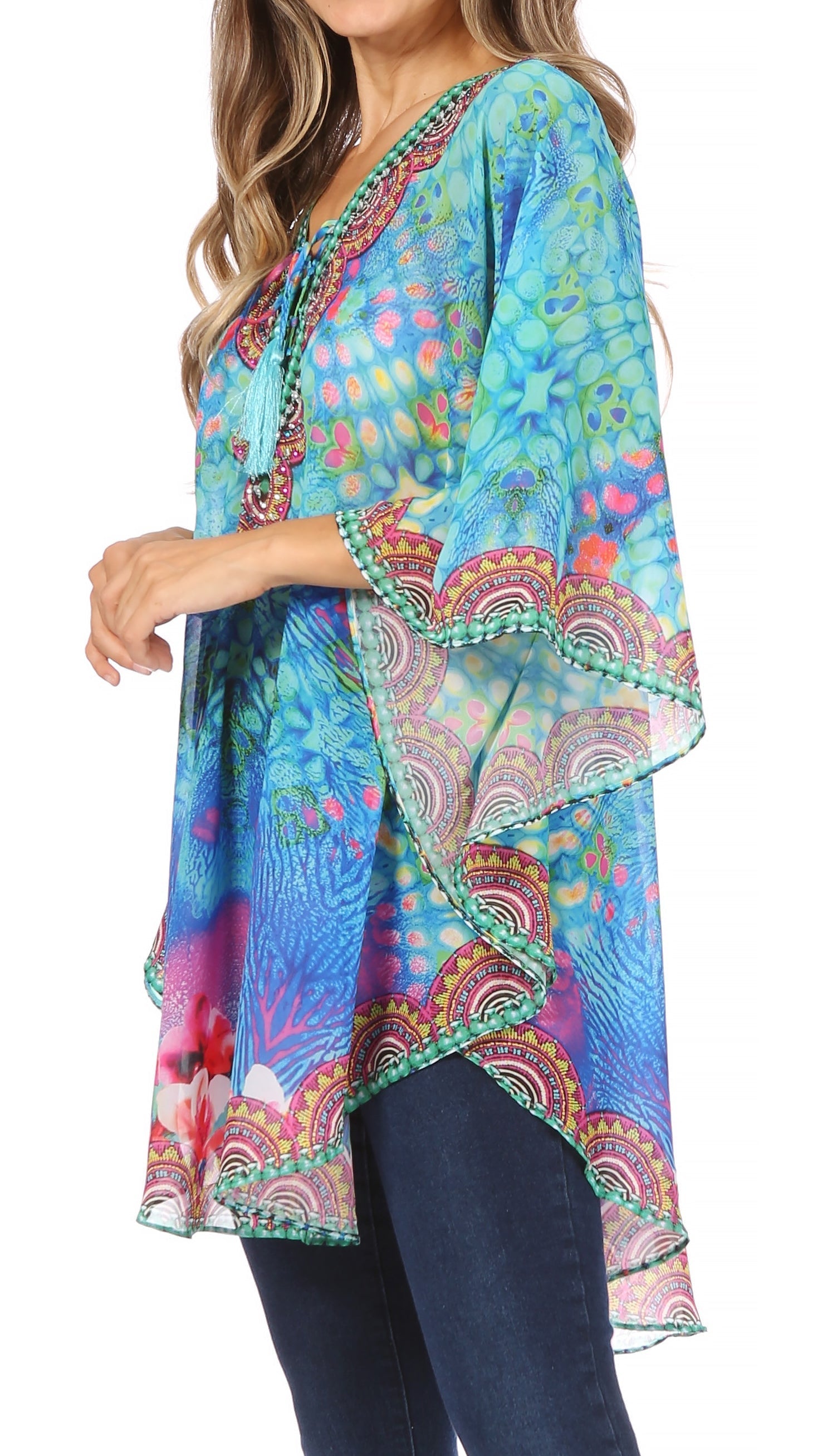 Colorful patterned top worn by a model on a white background