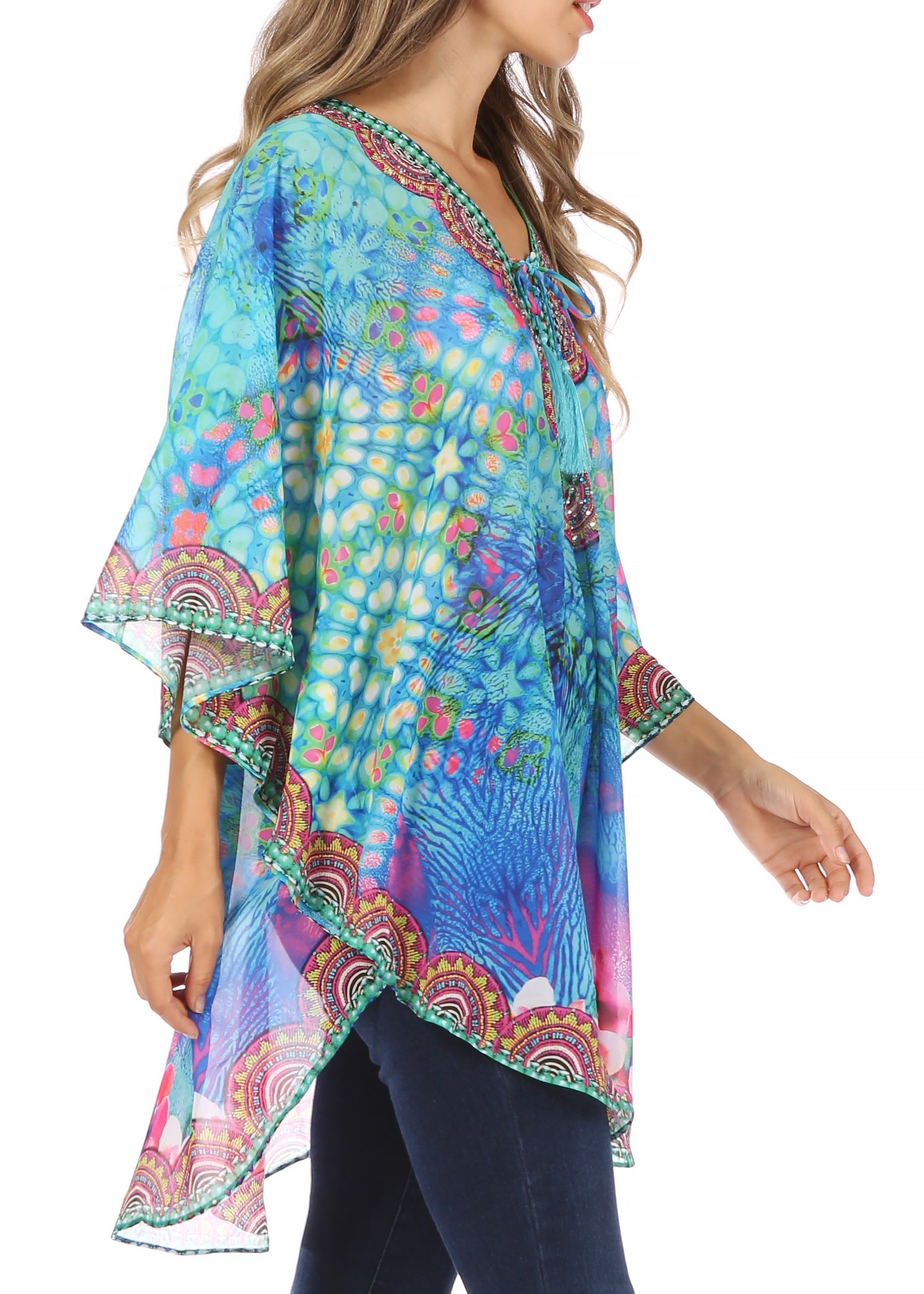 Colorful patterned top worn by a model on a white background