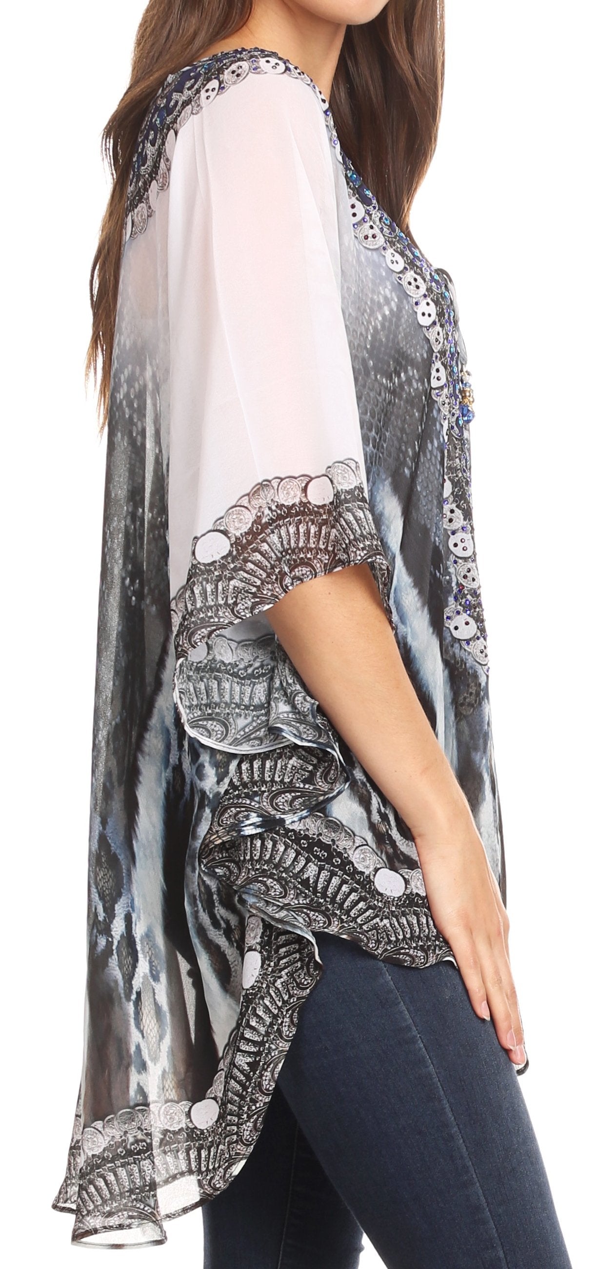 Woman wearing a patterned kimono-style top with a white background