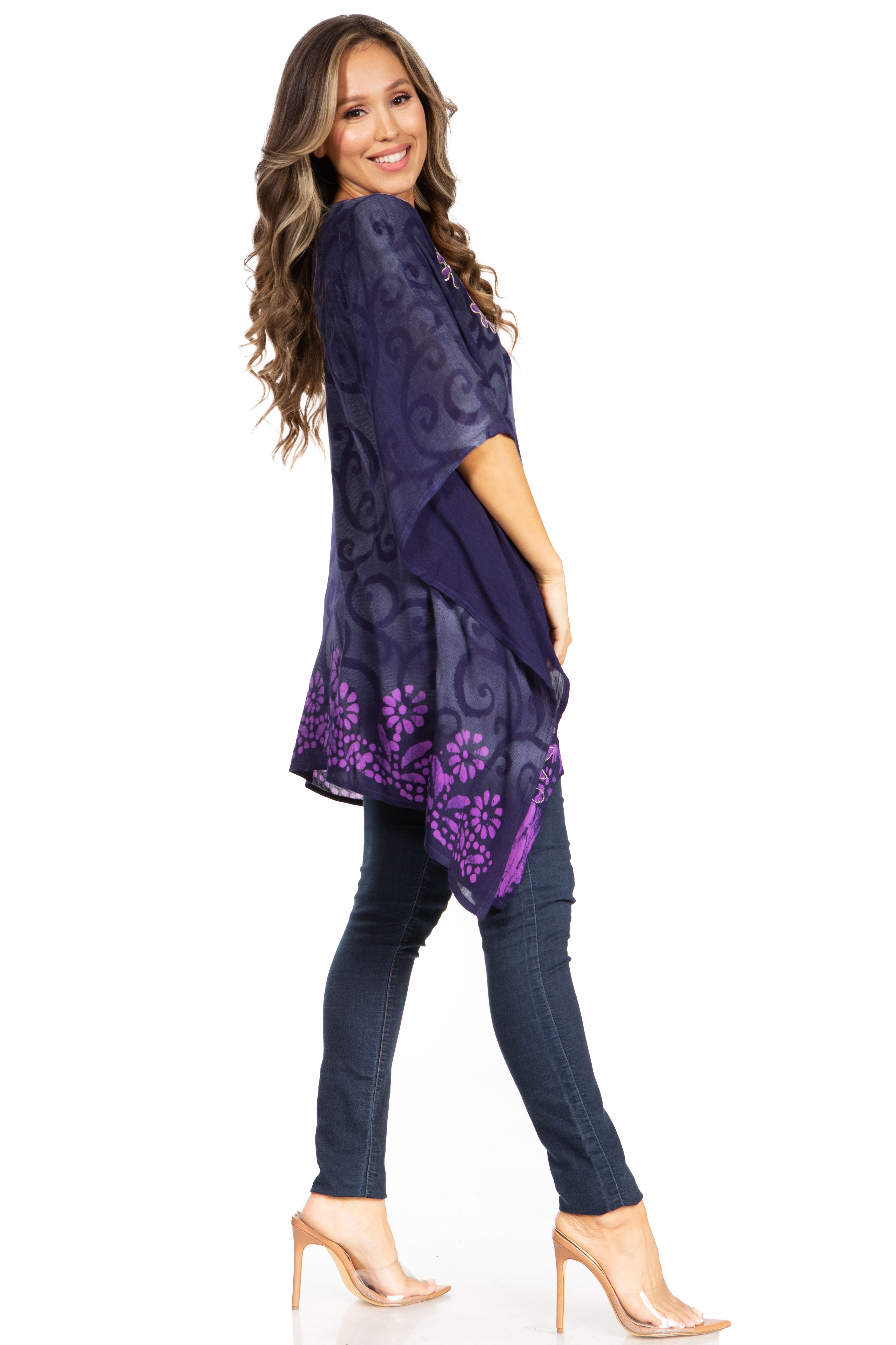 Woman wearing a dark blue floral patterned dress on a white background