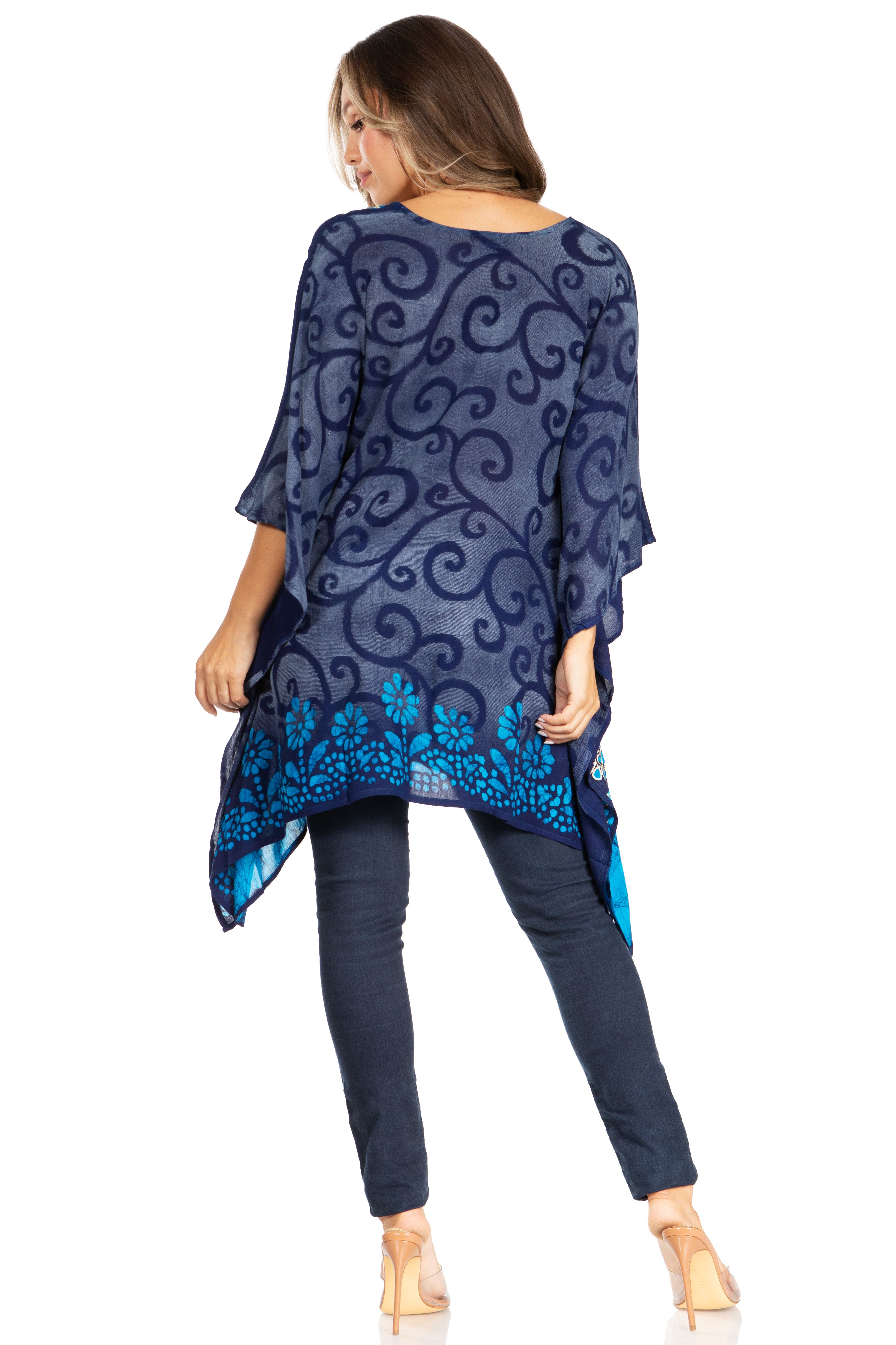 Woman wearing a blue patterned top with floral details on a white background