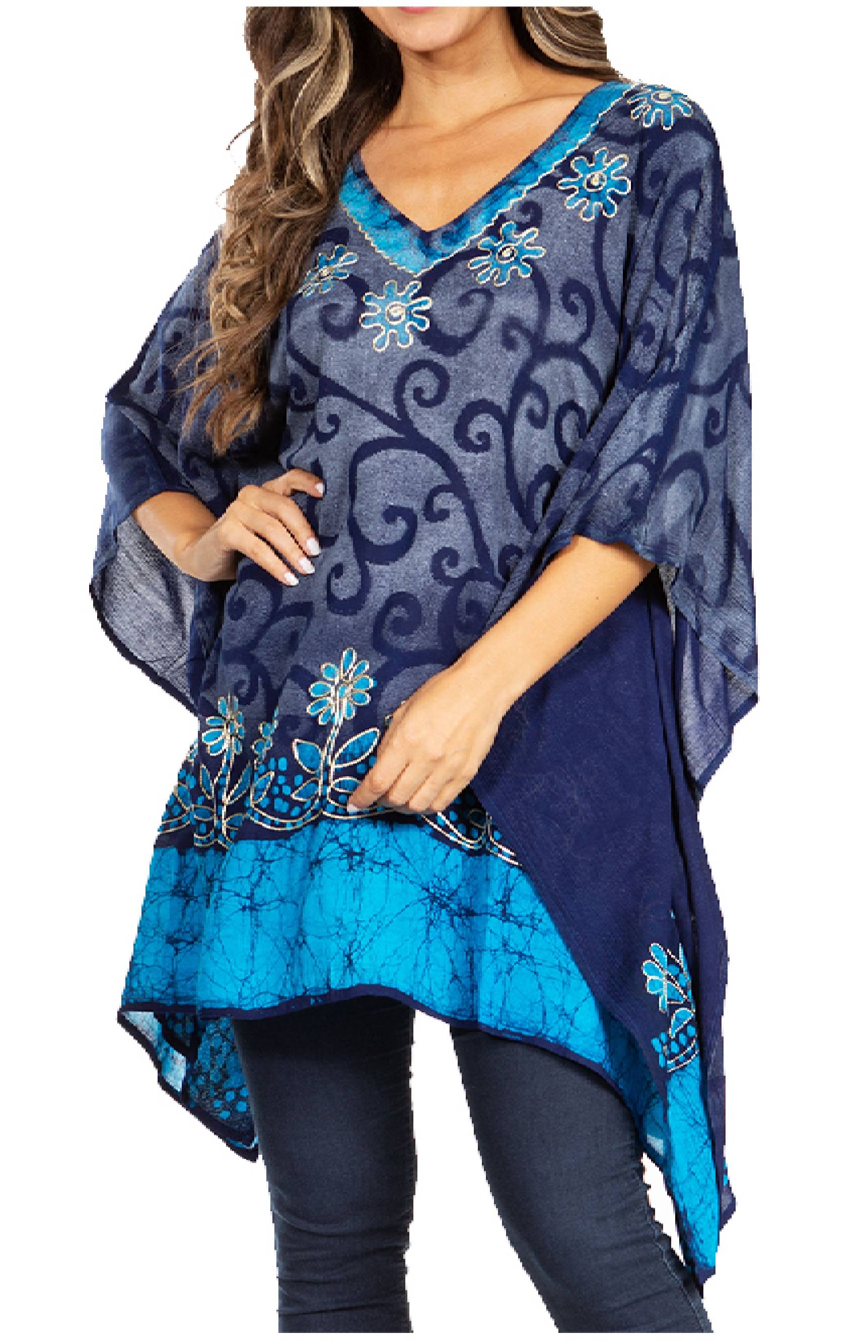 Navy and blue patterned poncho with floral embellishments on a white background