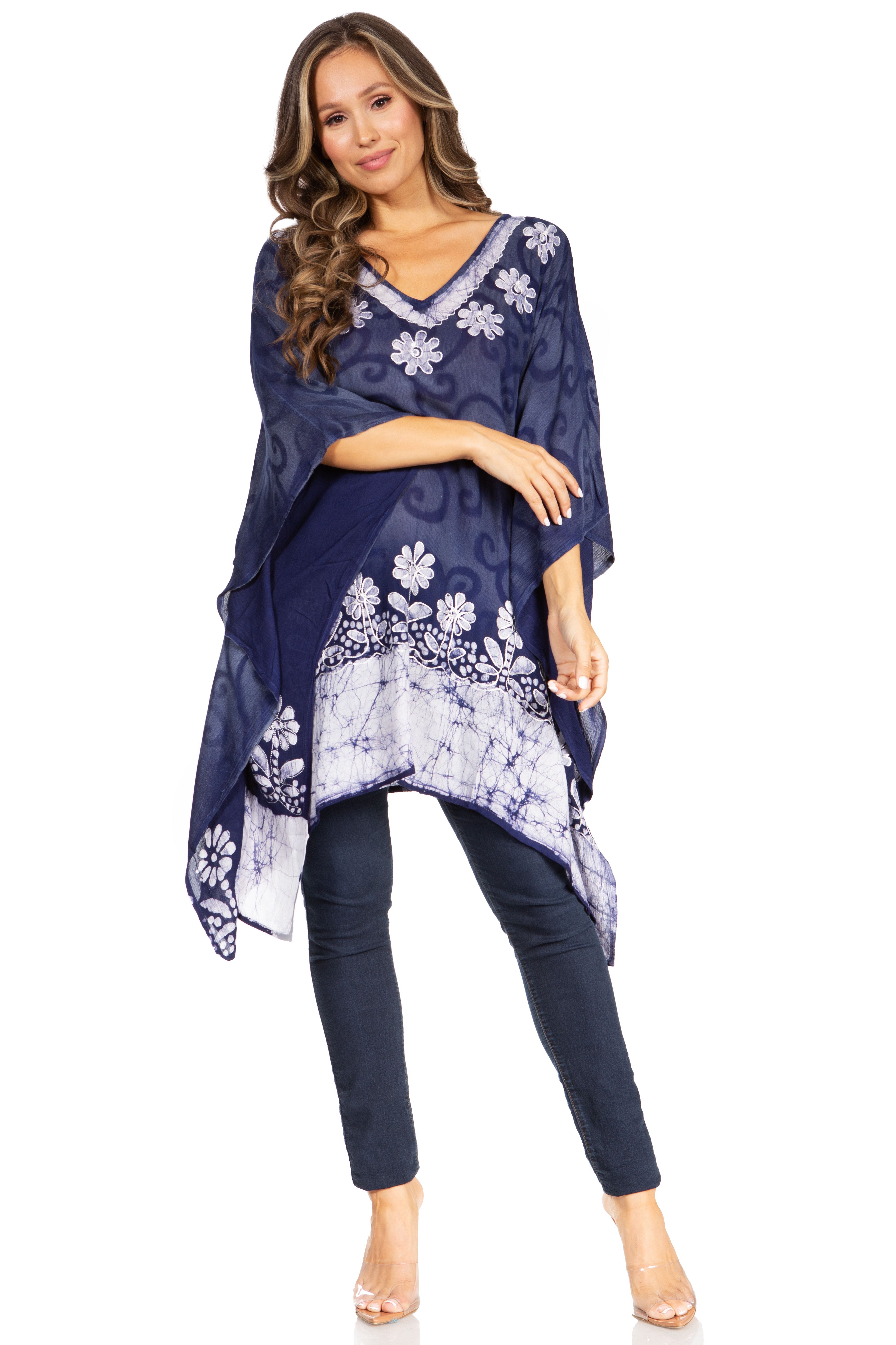 Woman wearing a navy blue floral dress with a white background