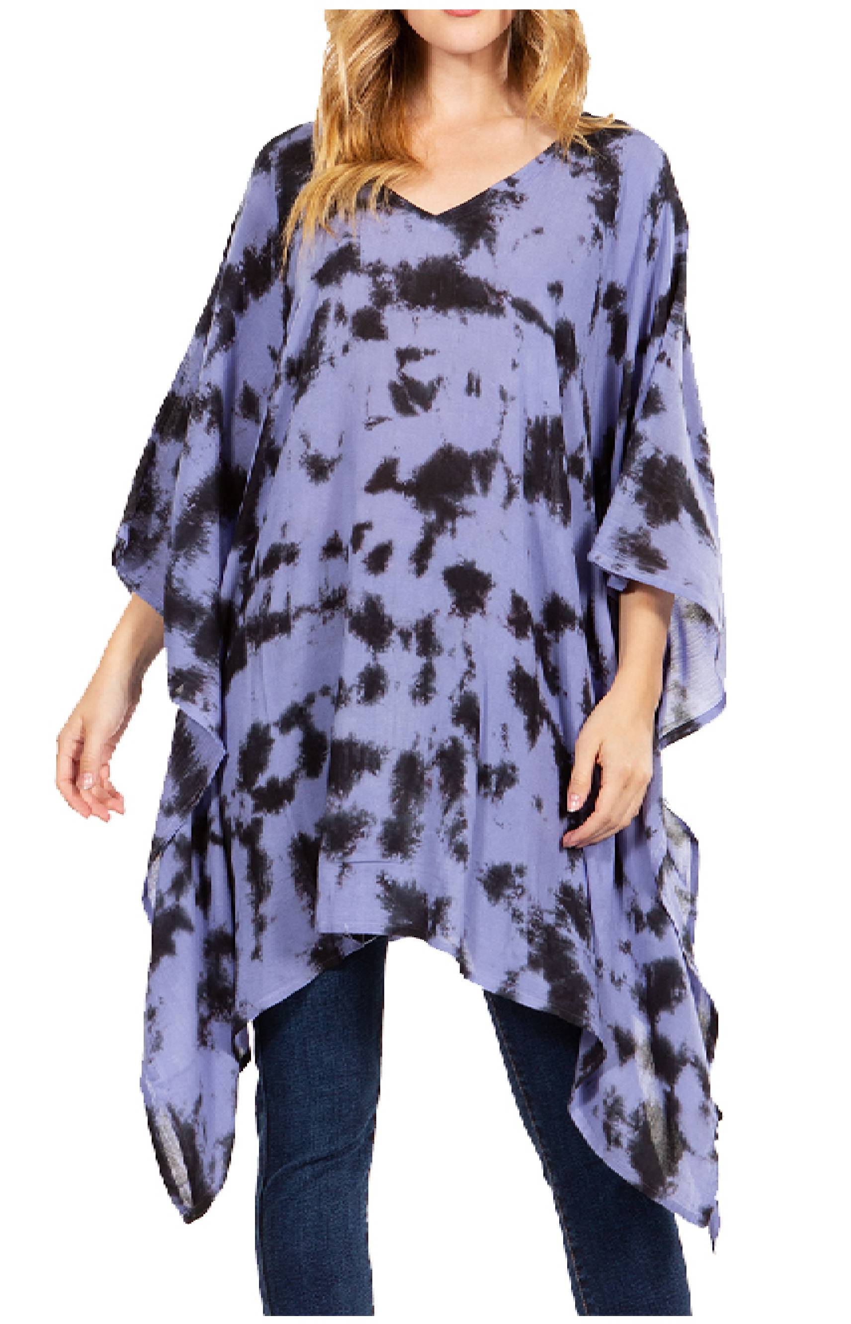 Woman wearing a tie-dye poncho with a white background