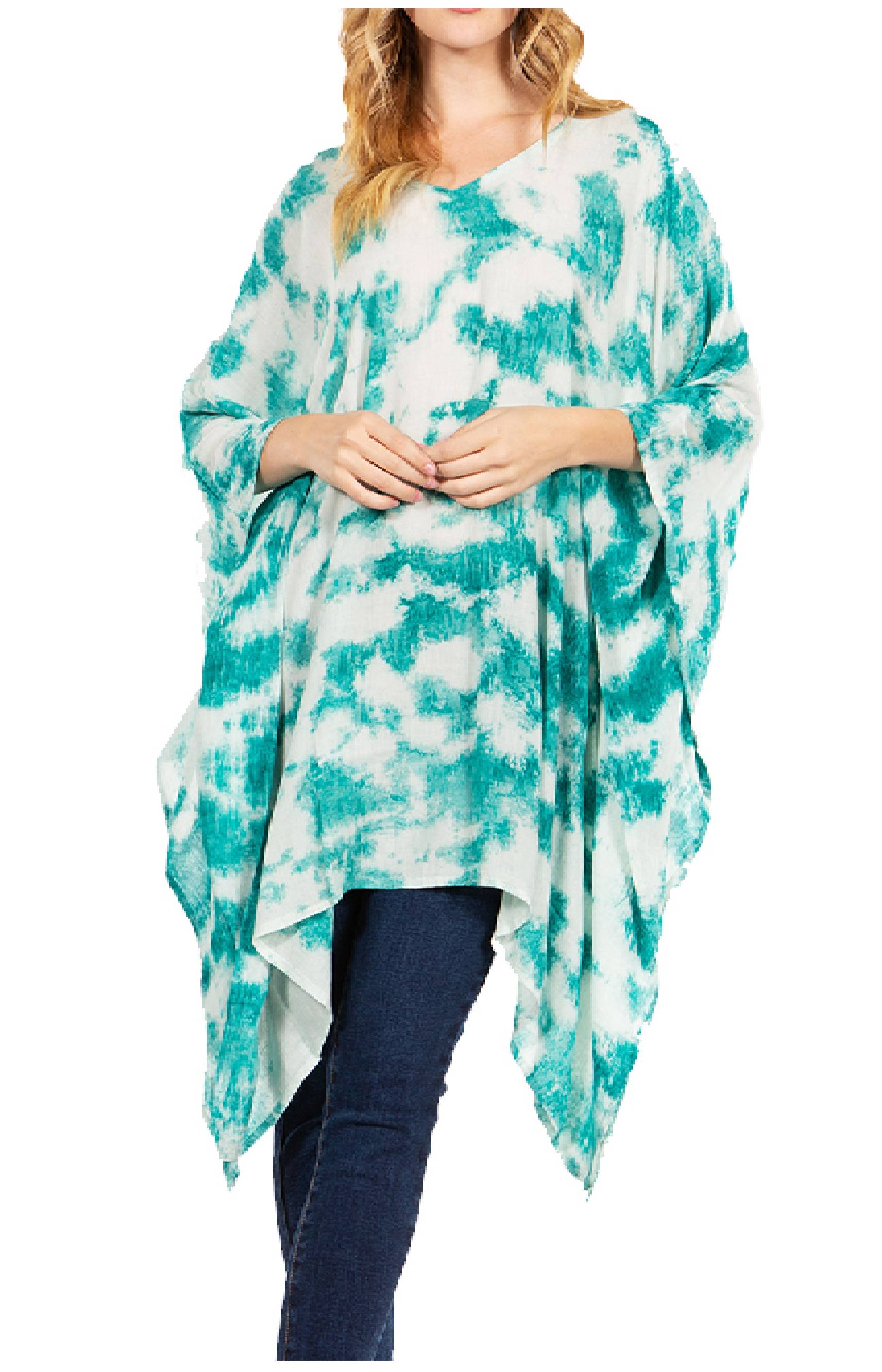 Woman wearing a teal and white tie-dye poncho on a white background