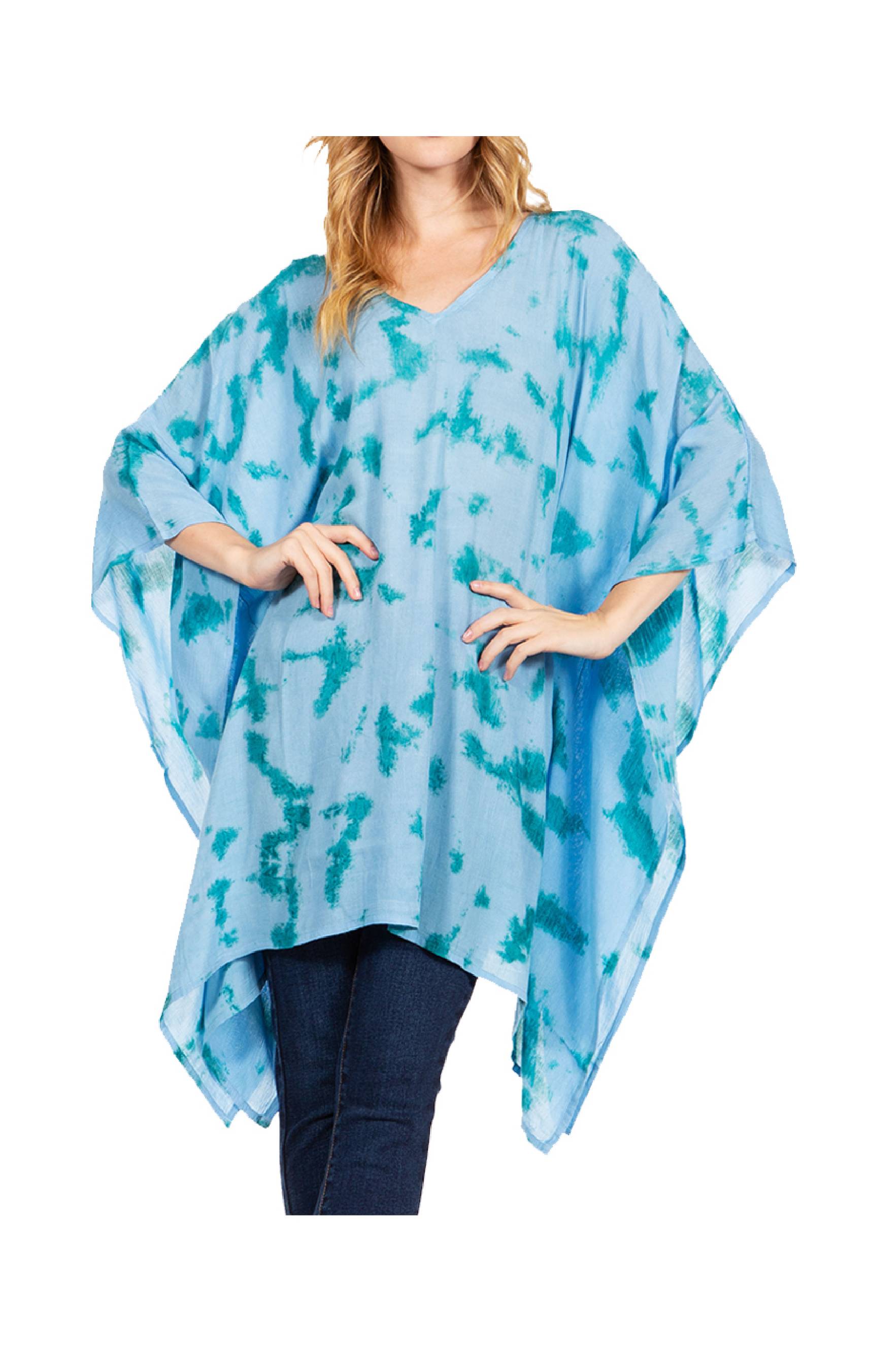 Woman wearing a blue tie-dye poncho on a white background