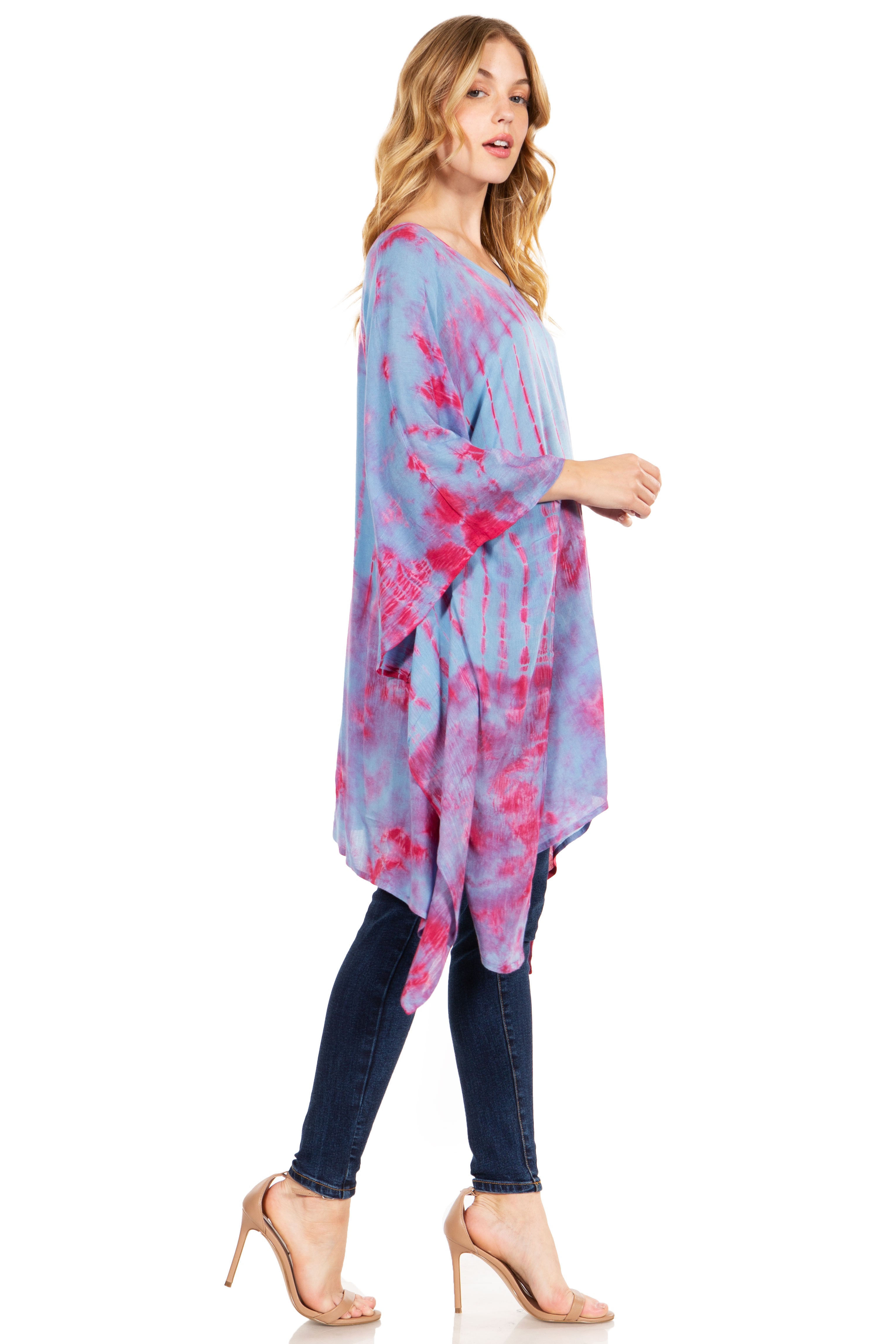 Woman wearing a colorful tie-dye dress on a white background