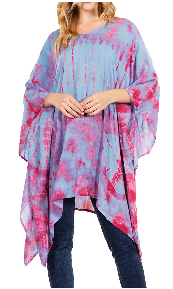 Woman wearing a tie-dye poncho with pink and blue patterns on a white background