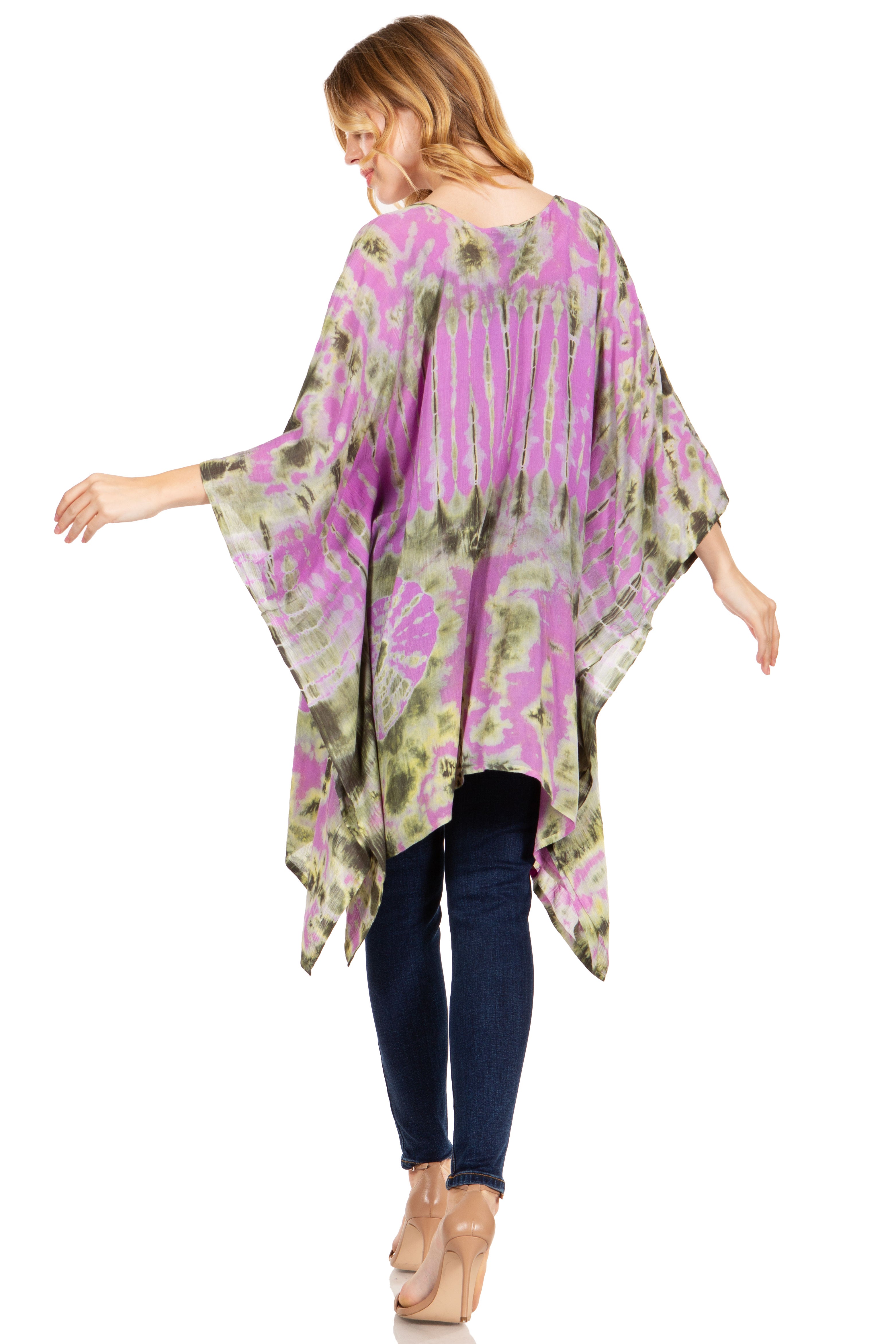 Woman wearing a colorful kimono-style top on a white background