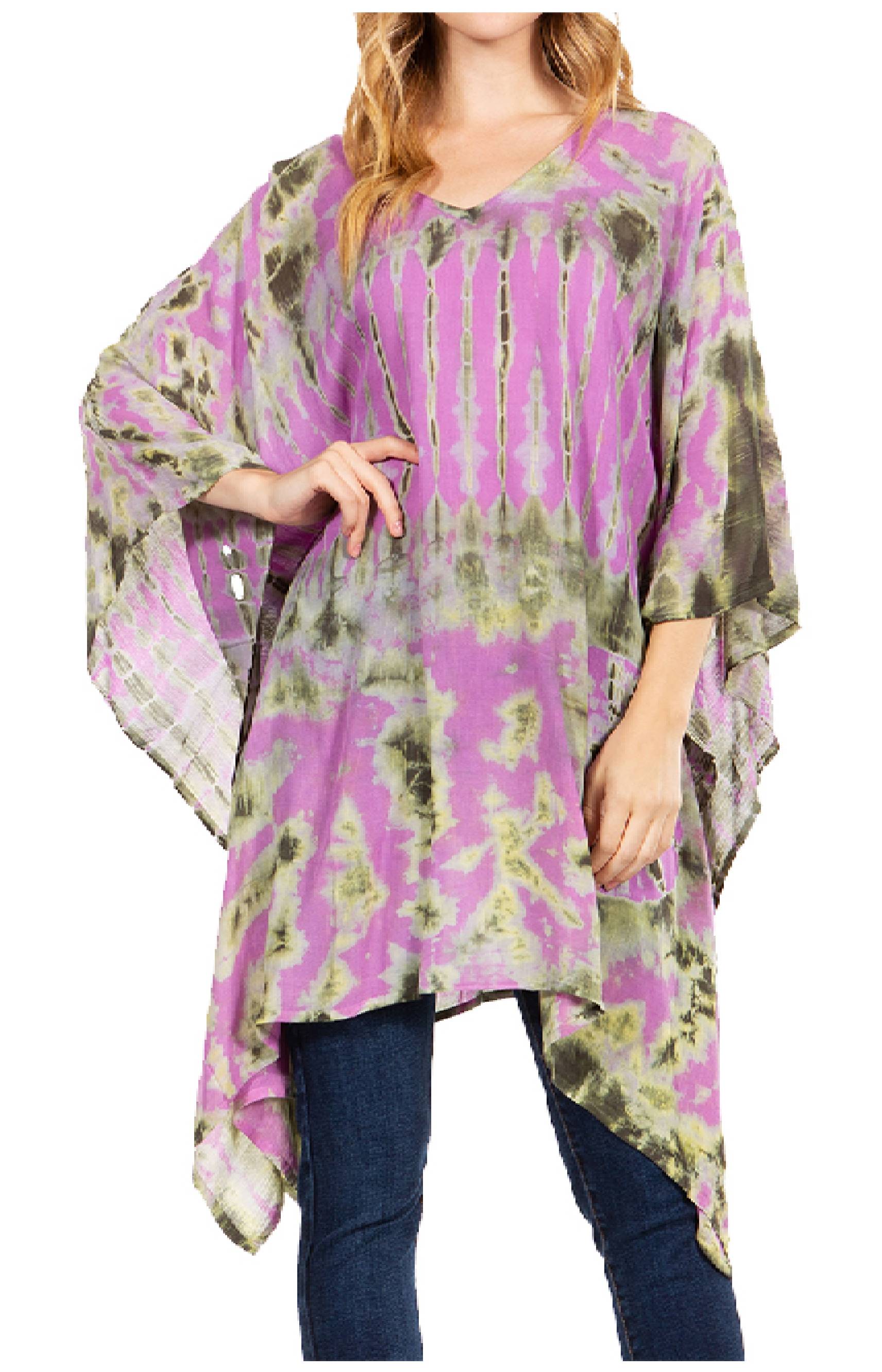 Woman wearing a purple and green tie-dye poncho over jeans on a white background