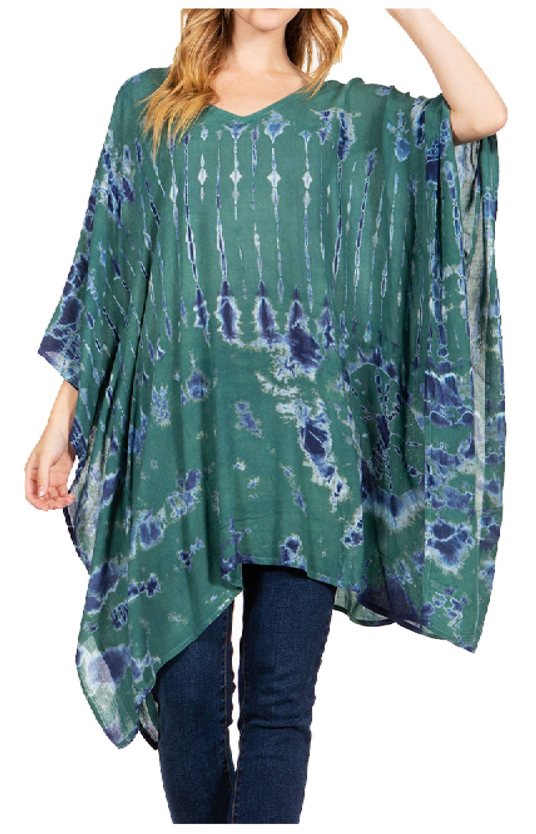 Green and blue tie-dye poncho worn by a person on a white background