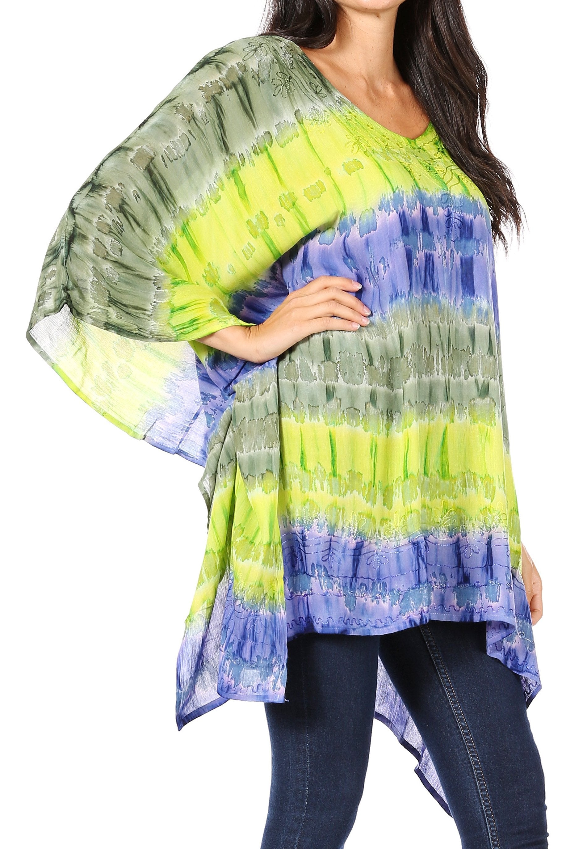 Woman wearing a colorful tie-dye top with a white background