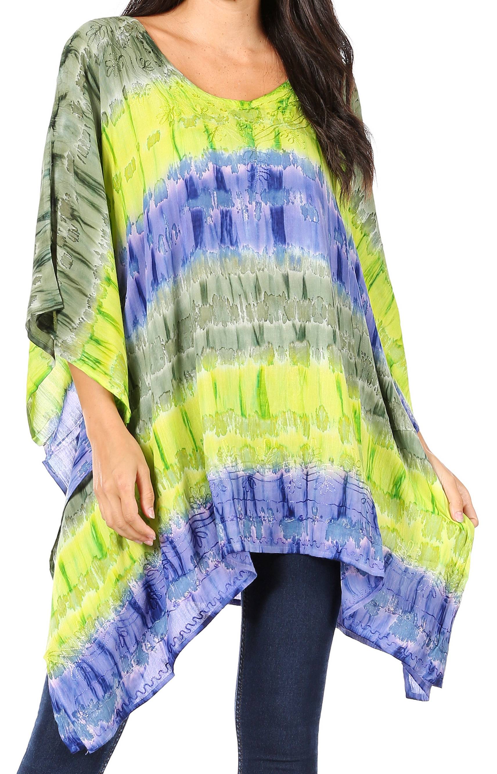 Woman wearing a colorful tie-dye shirt with blue and green patterns.