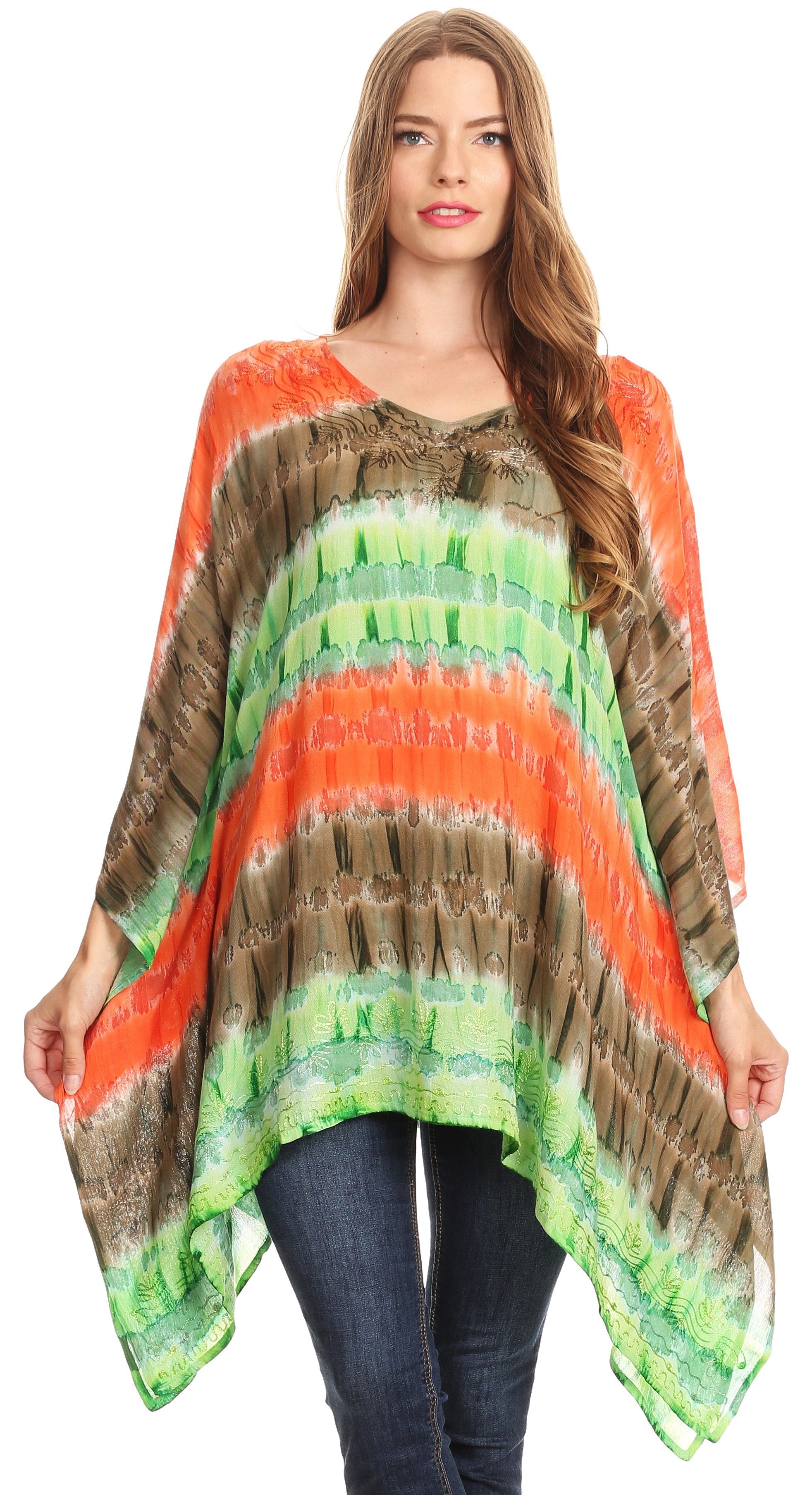Woman wearing a colorful tie-dye poncho with an orange, green, and brown pattern on a white background.