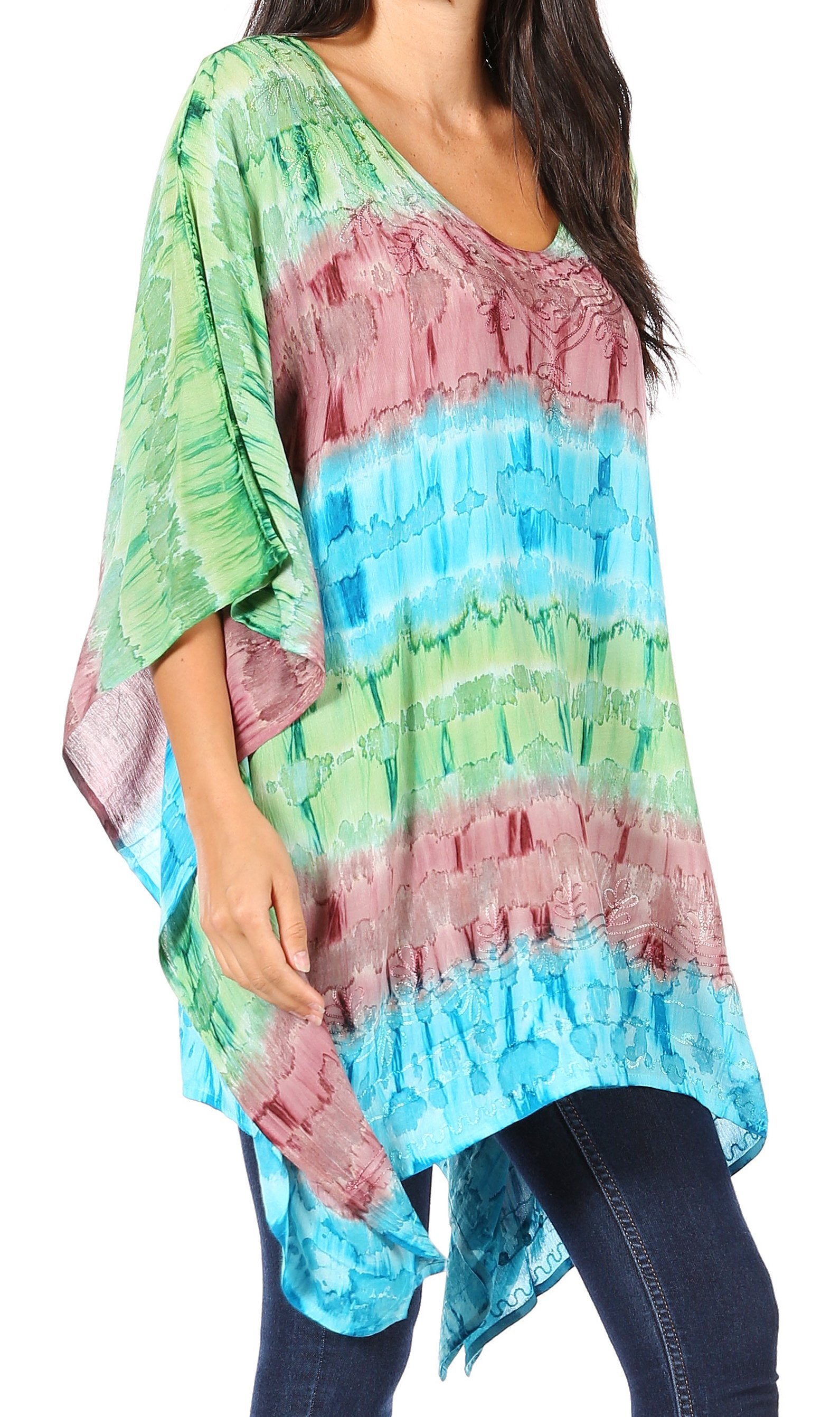 Colorful tie-dye poncho worn by a person on a white background