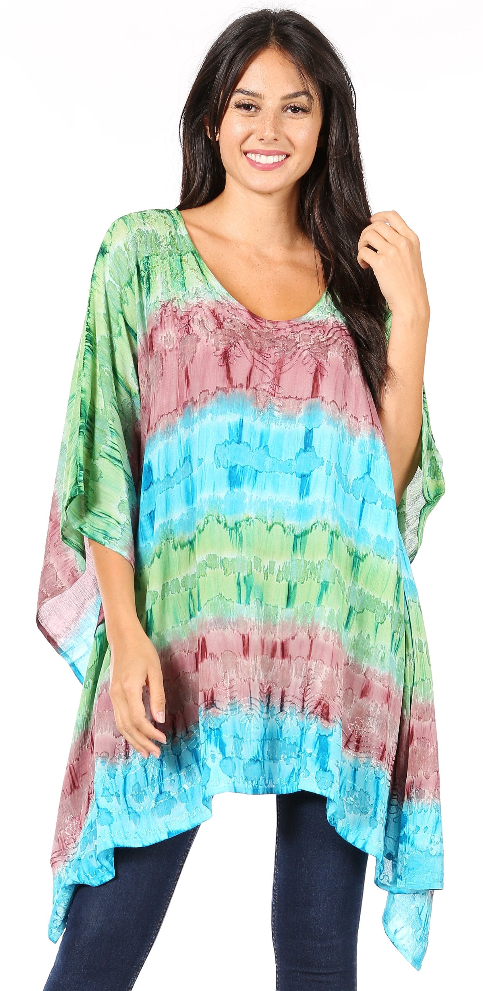 Woman wearing a colorful, patterned top with a white background