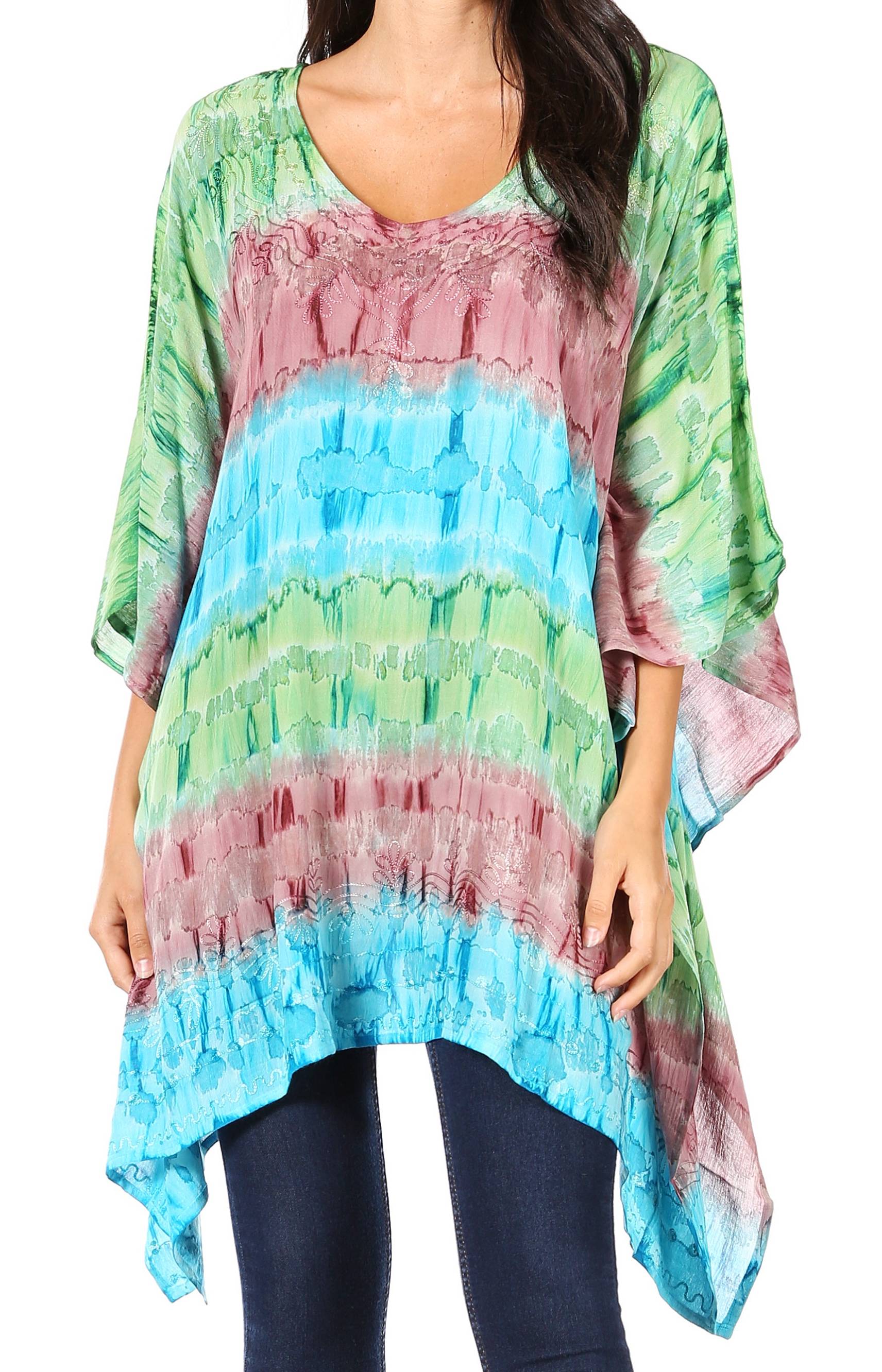 Multicolored tie-dye top worn by a person on a plain background