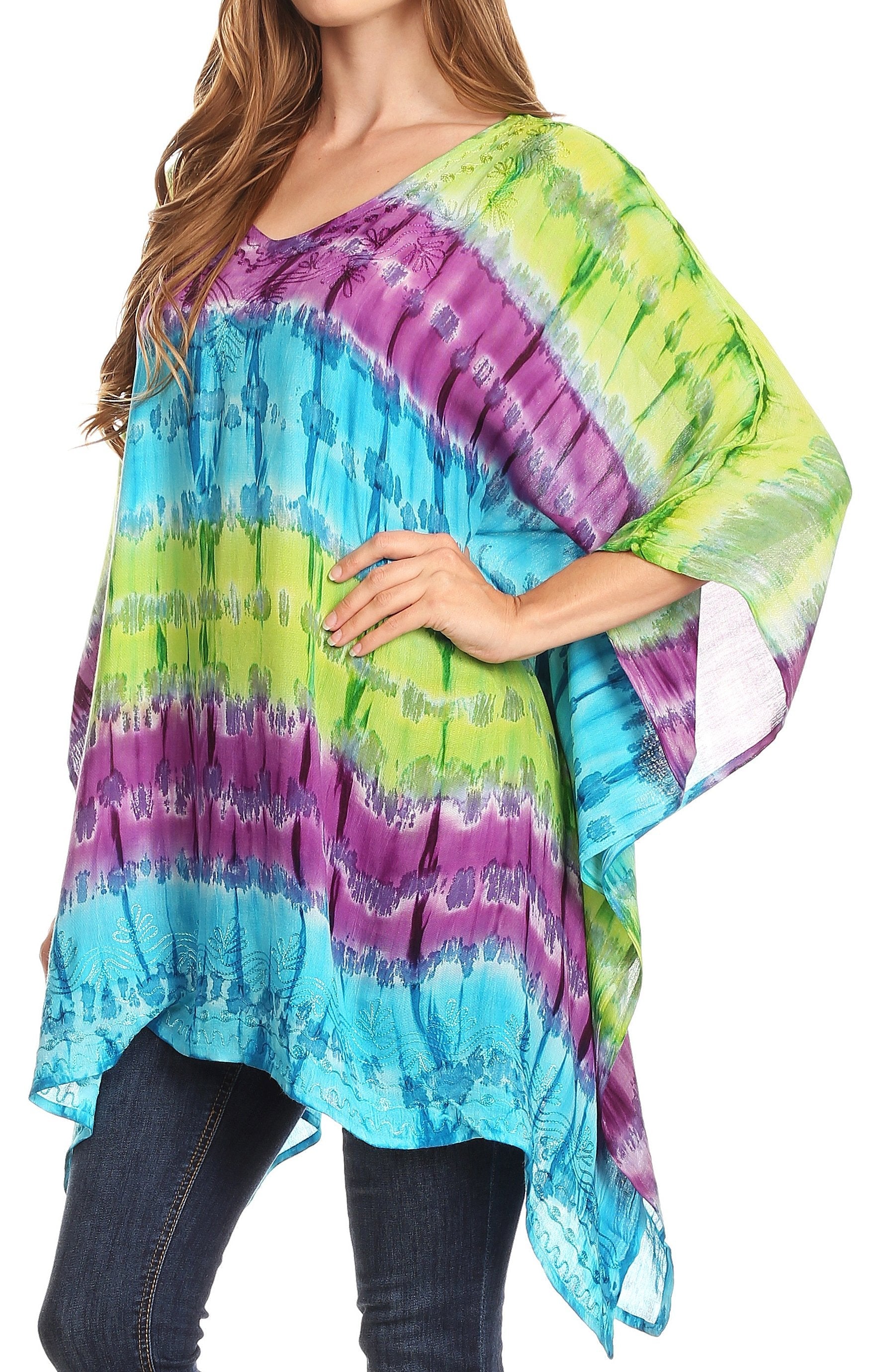Woman wearing a colorful tie-dye poncho with a white background