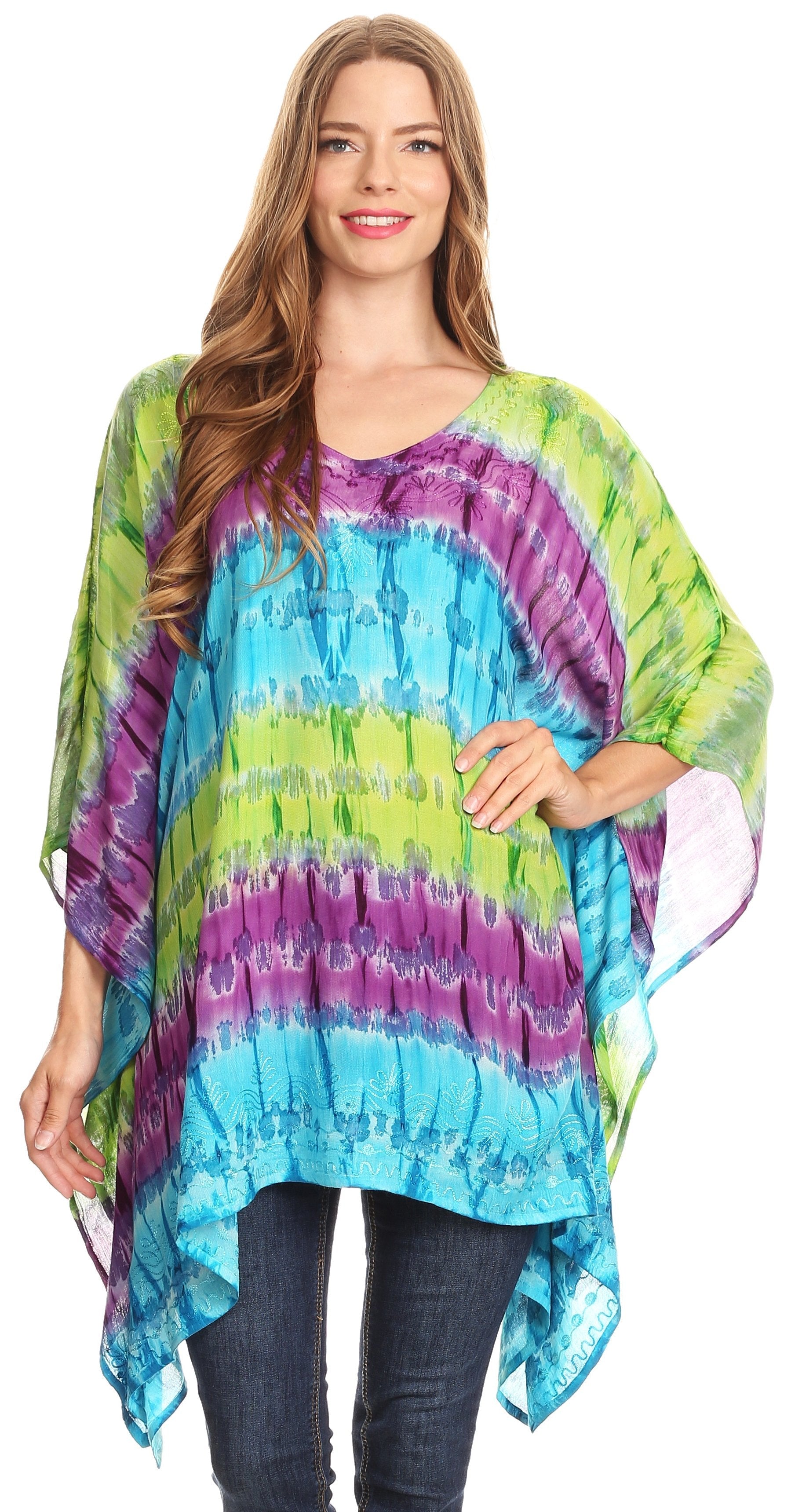Woman wearing a colorful tie-dye poncho on a white background