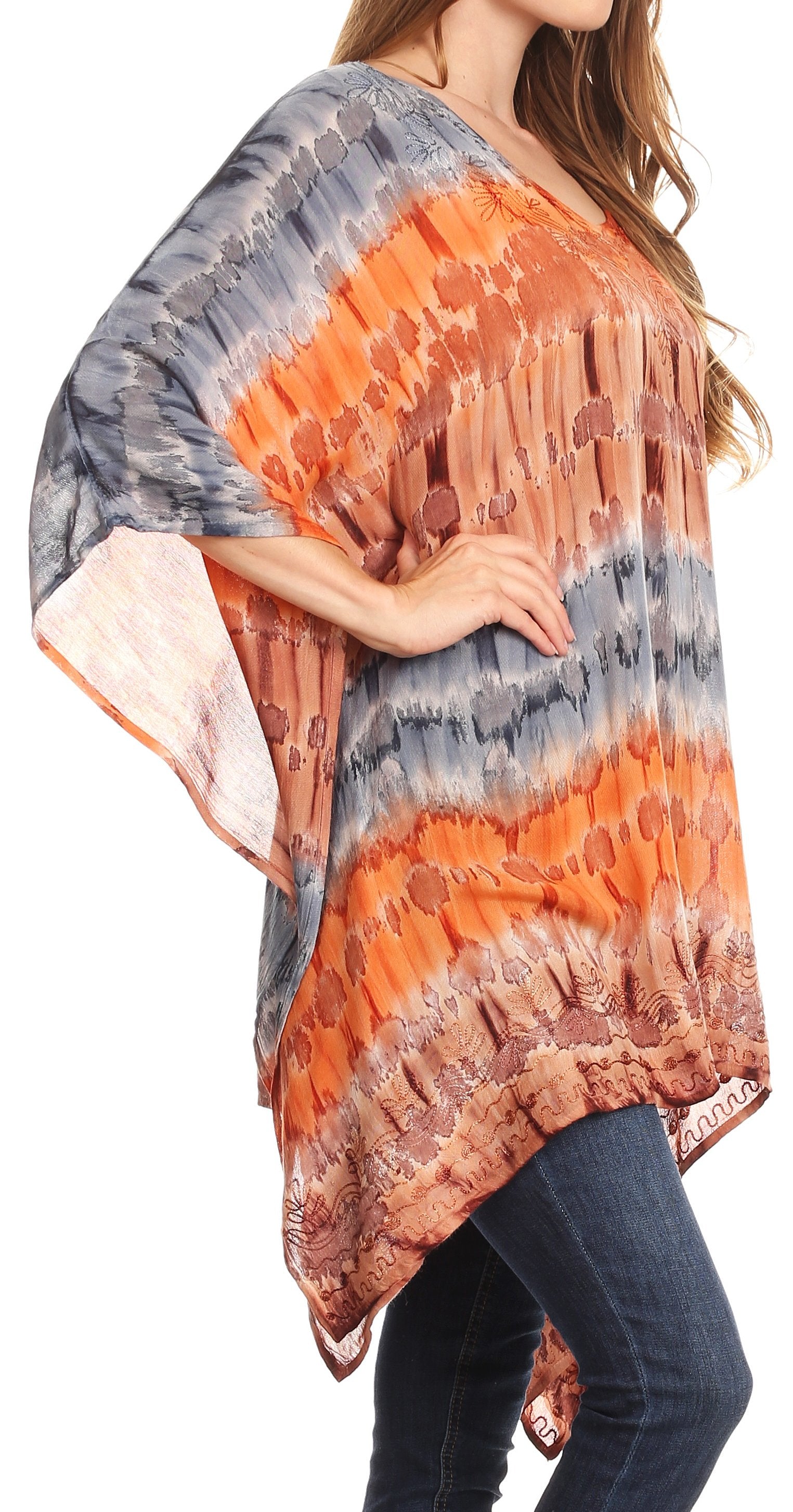 Woman wearing a colorful tie-dye poncho with a white background