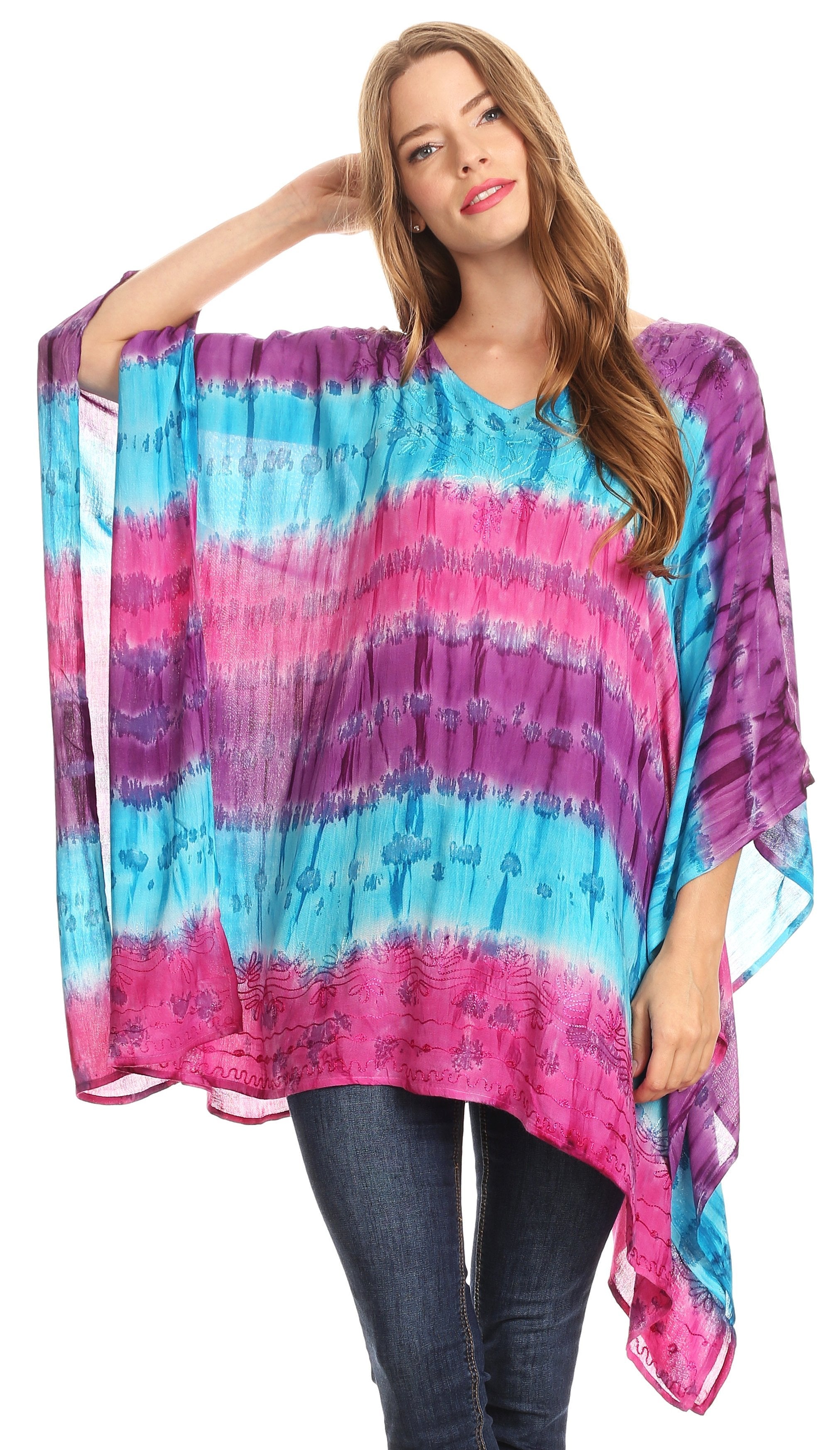 Woman wearing a colorful tie-dye poncho with a white background