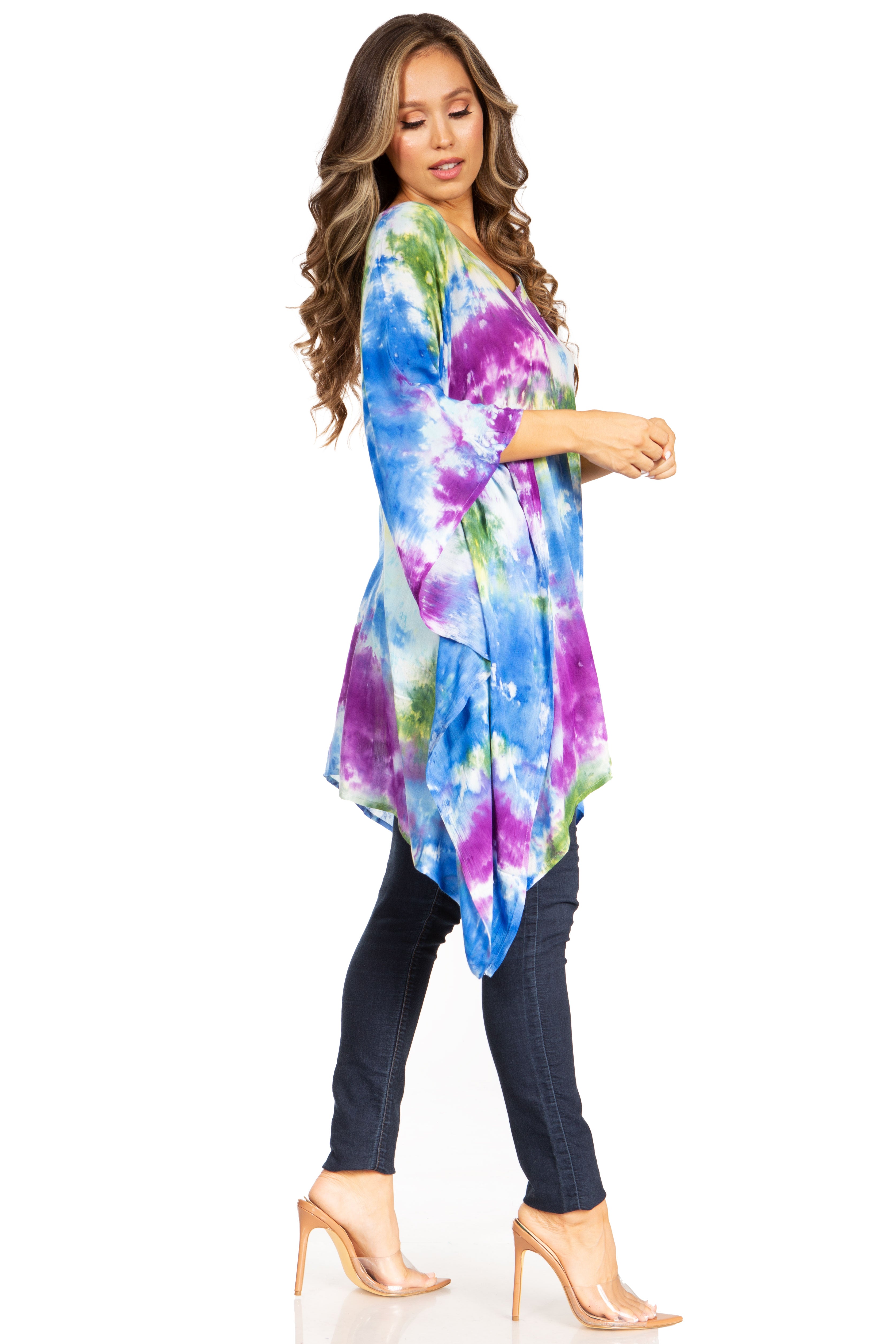 Woman wearing a colorful tie-dye dress on a white background