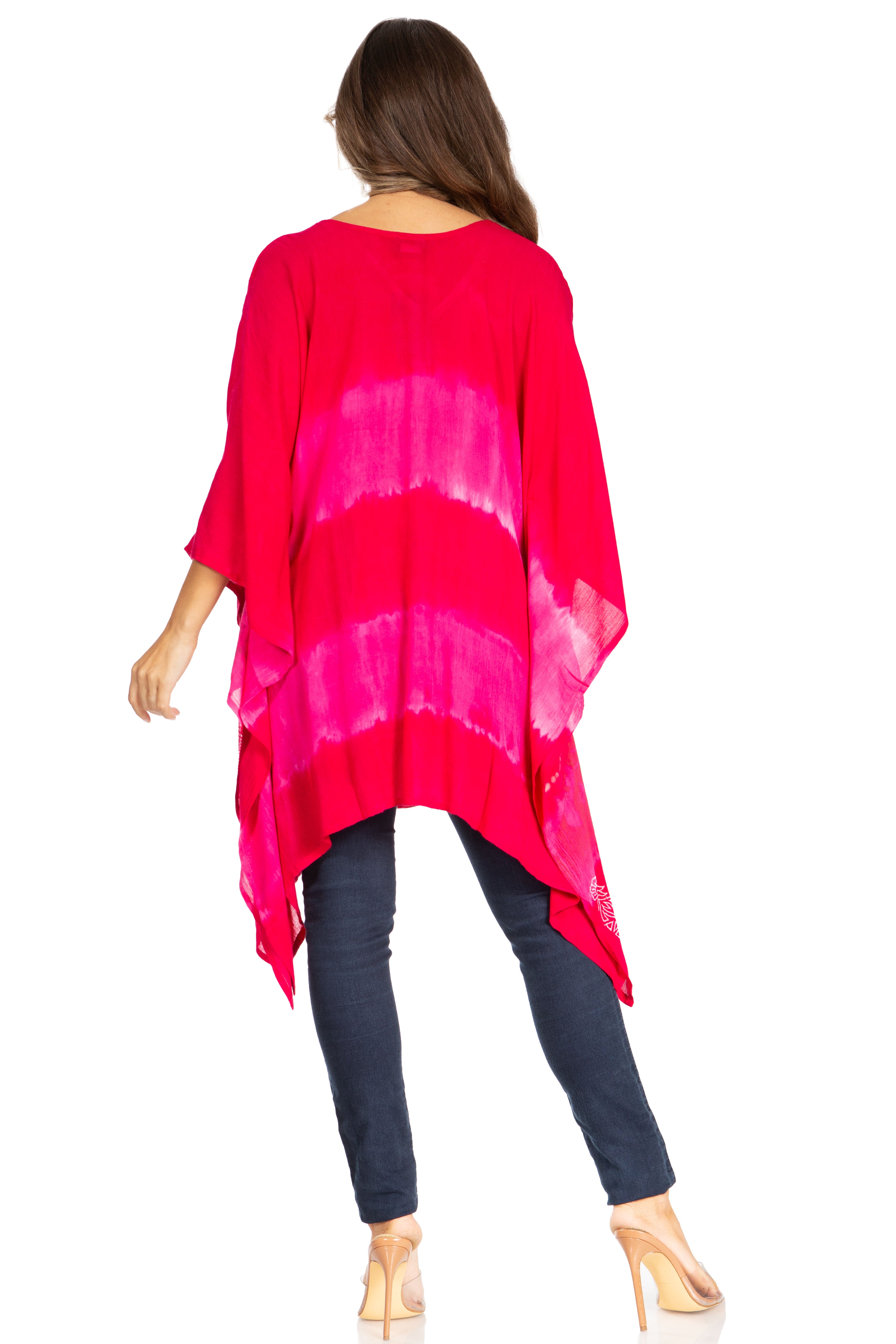 Woman wearing a bright pink kimono-style top on a white background