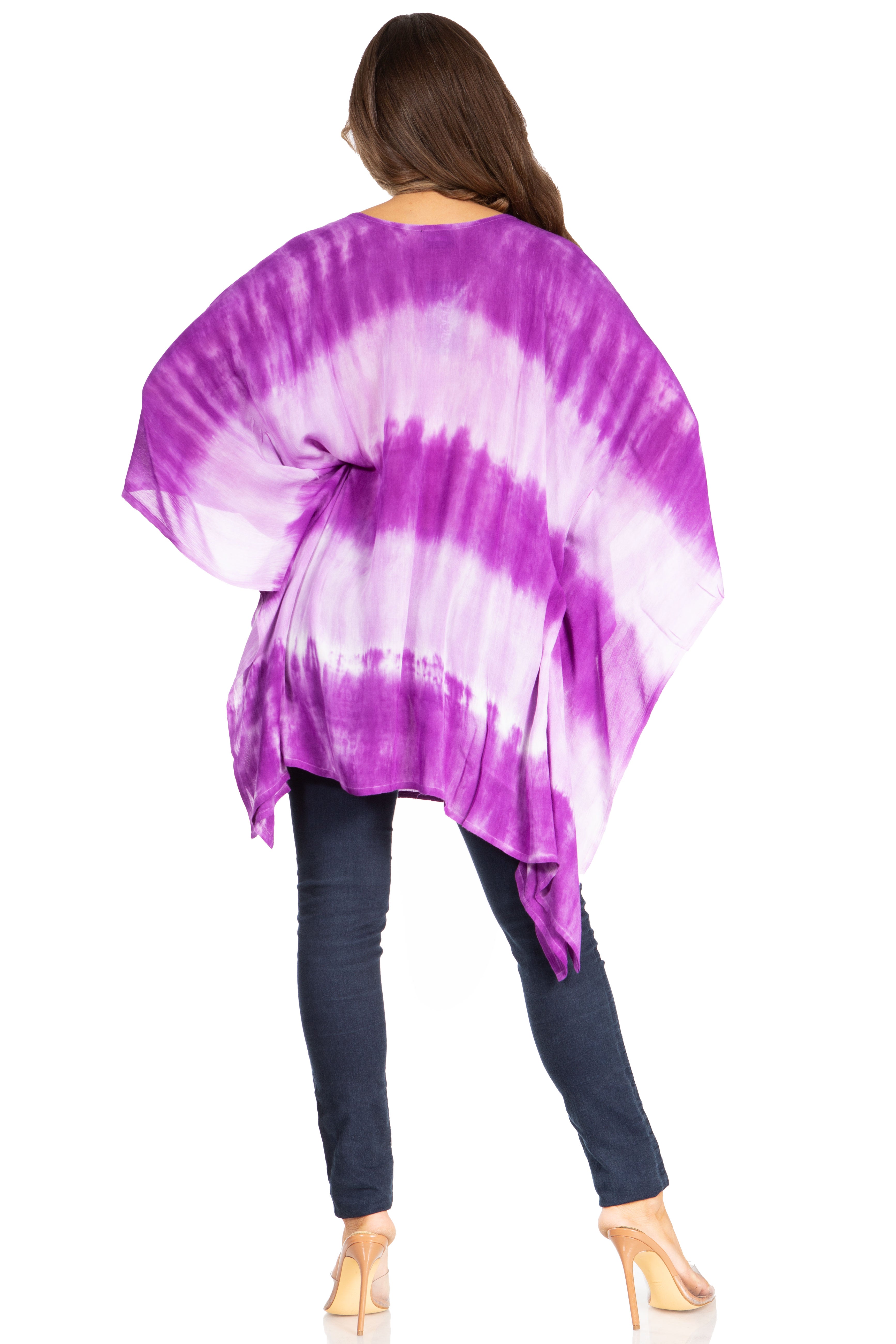 Woman wearing a purple and white tie-dye poncho on a white background
