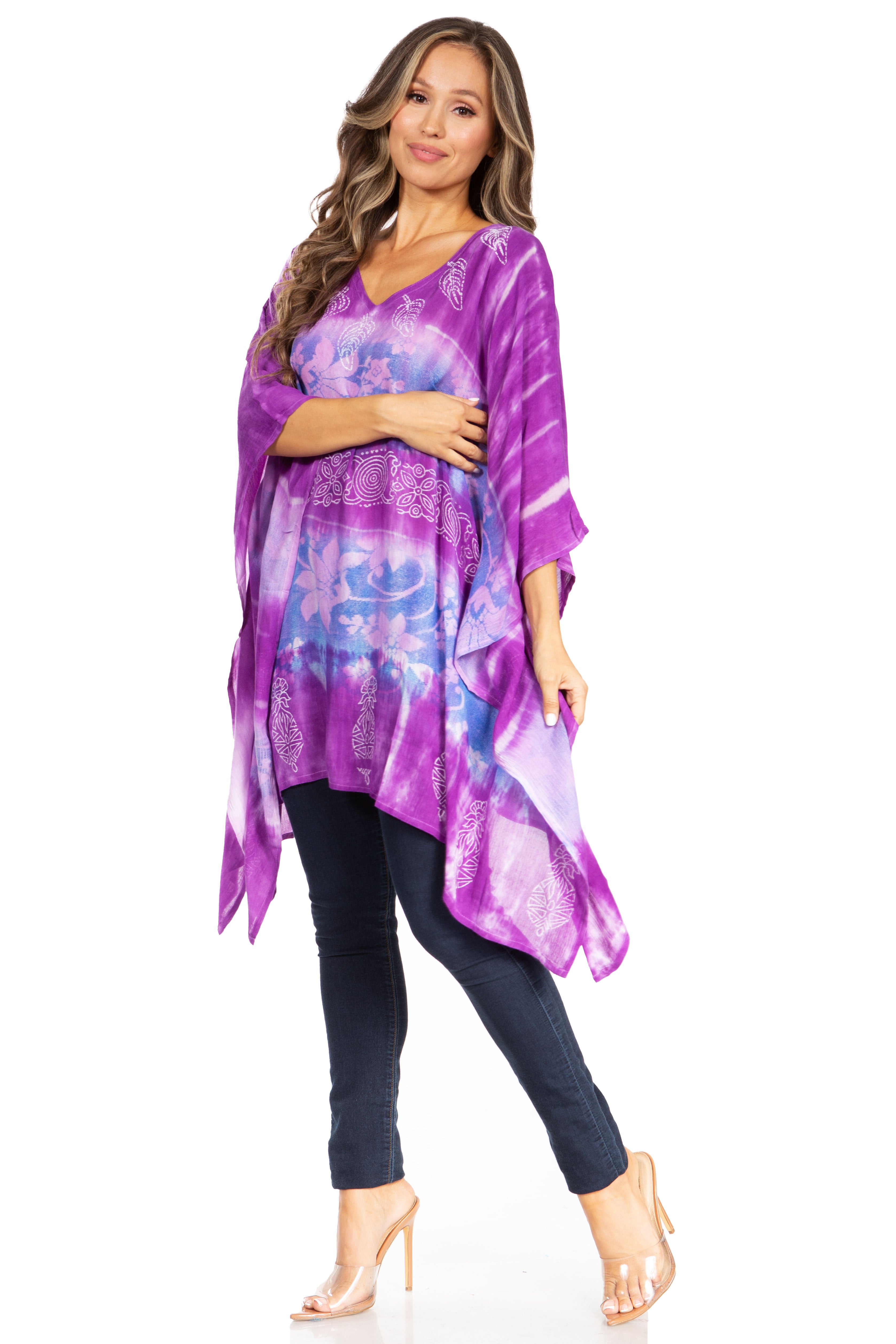 Woman wearing a purple tie-dye dress with a white background