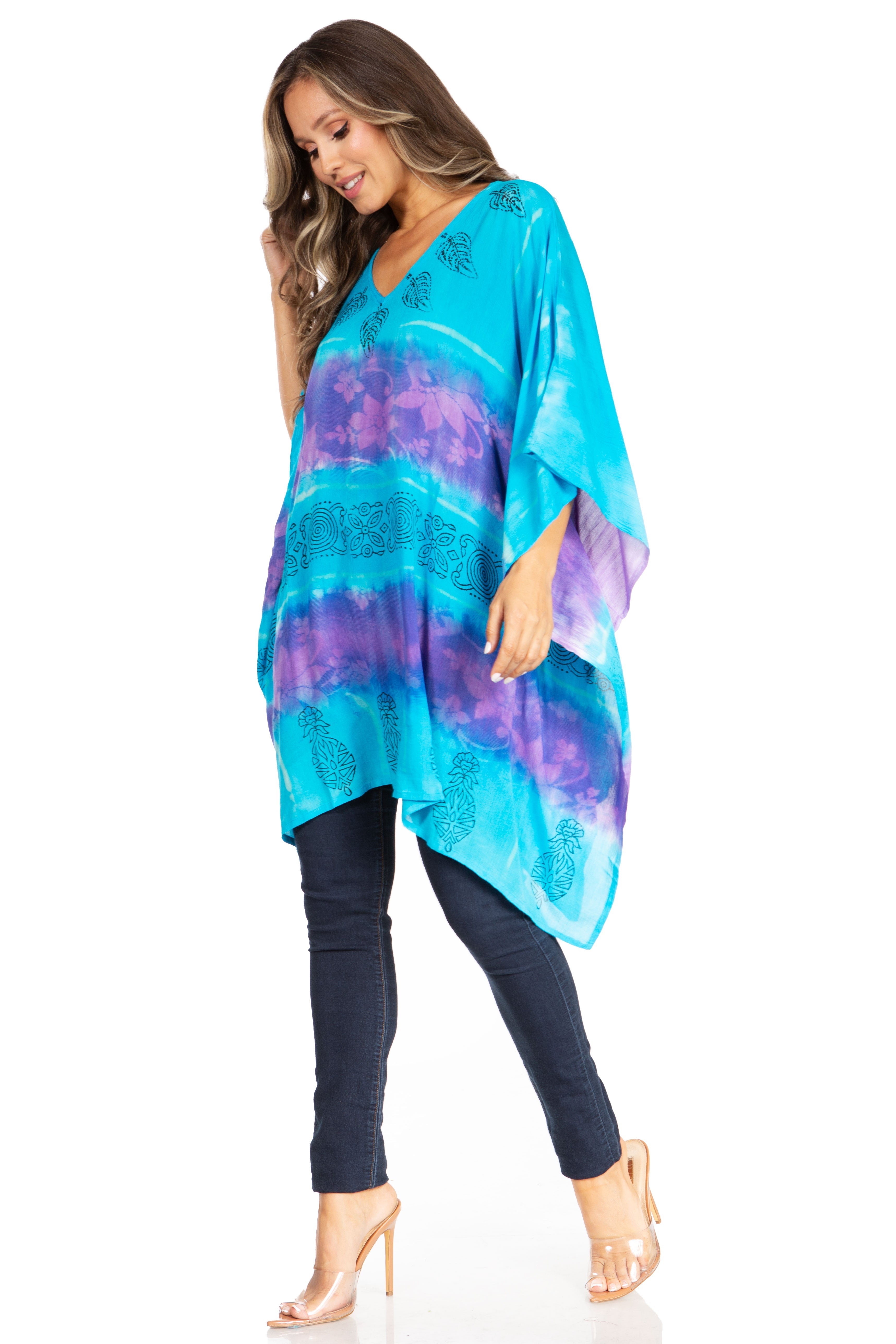 Woman wearing a colorful kimono-style garment on a white background