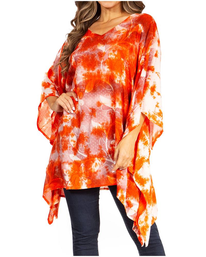 Orange and white tie-dye poncho worn by a person on a white background