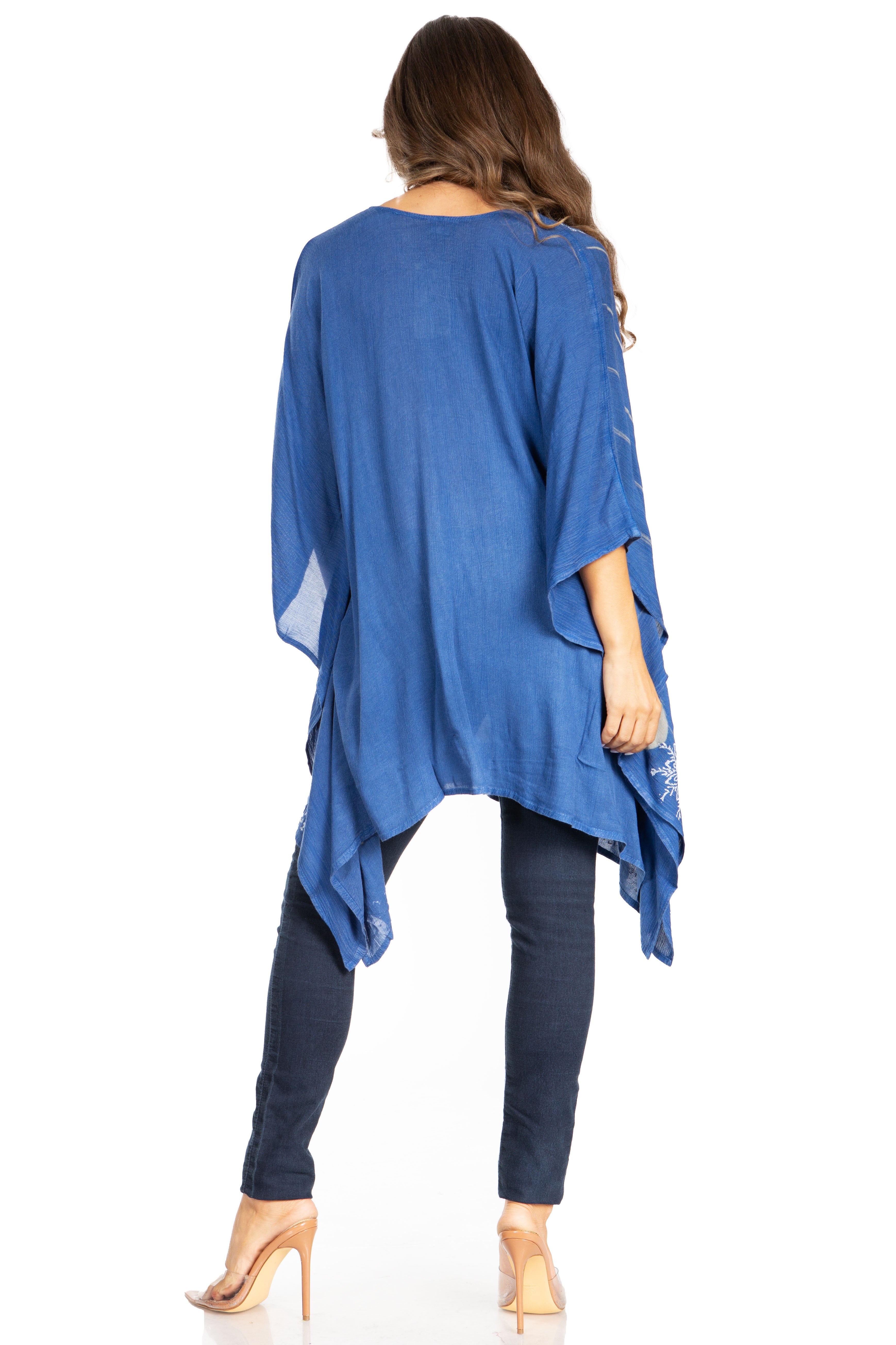Woman wearing a blue kimono-style garment on a white background