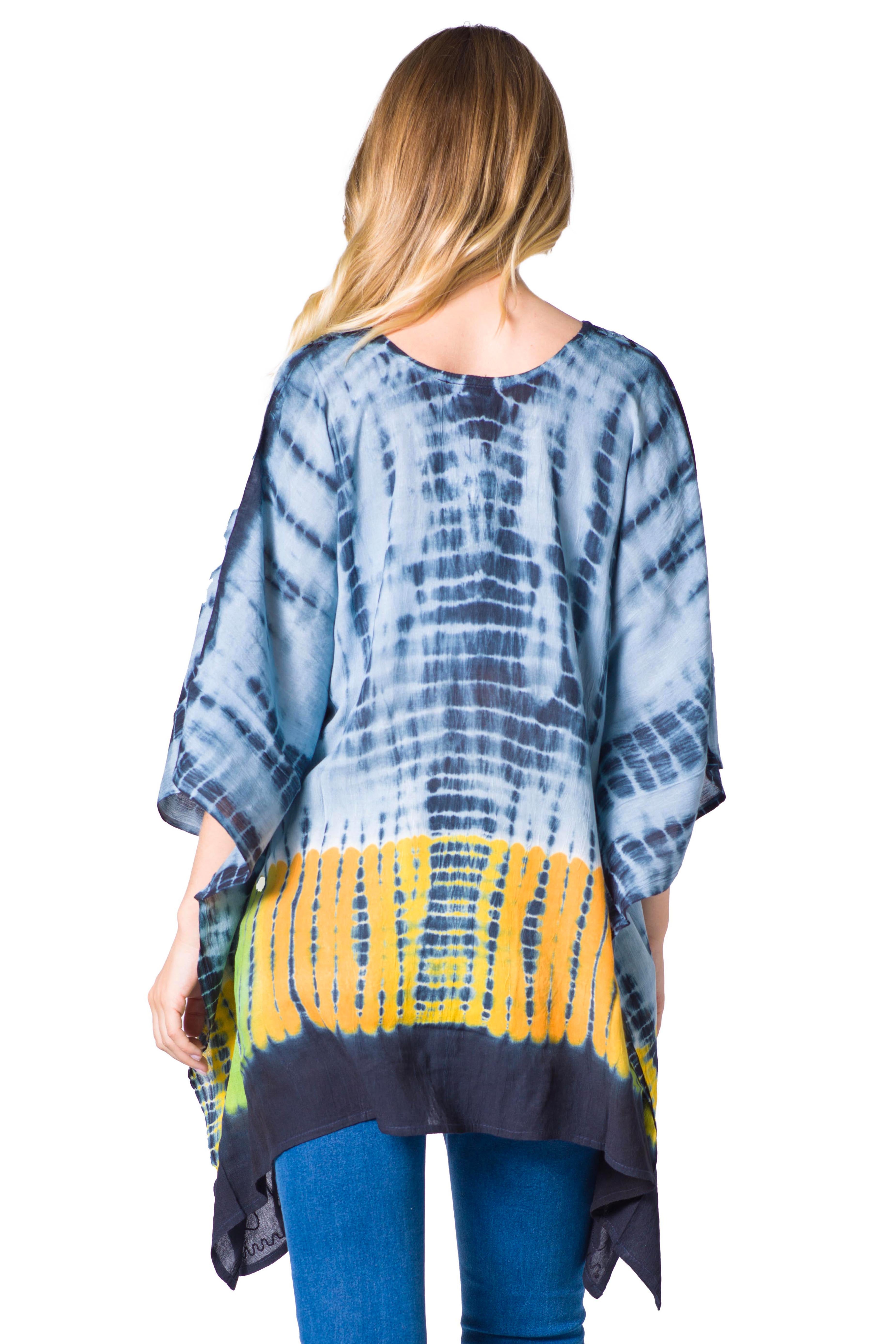 Woman wearing a tie-dye shirt with blue and yellow pattern on a white background