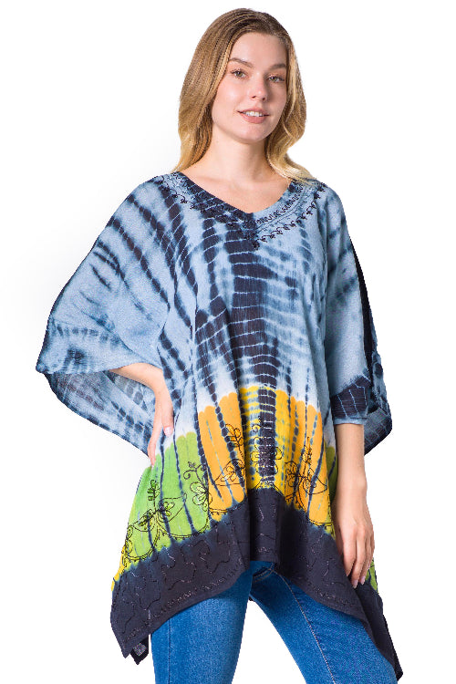 Woman wearing a tie-dye poncho with a colorful pattern on a white background