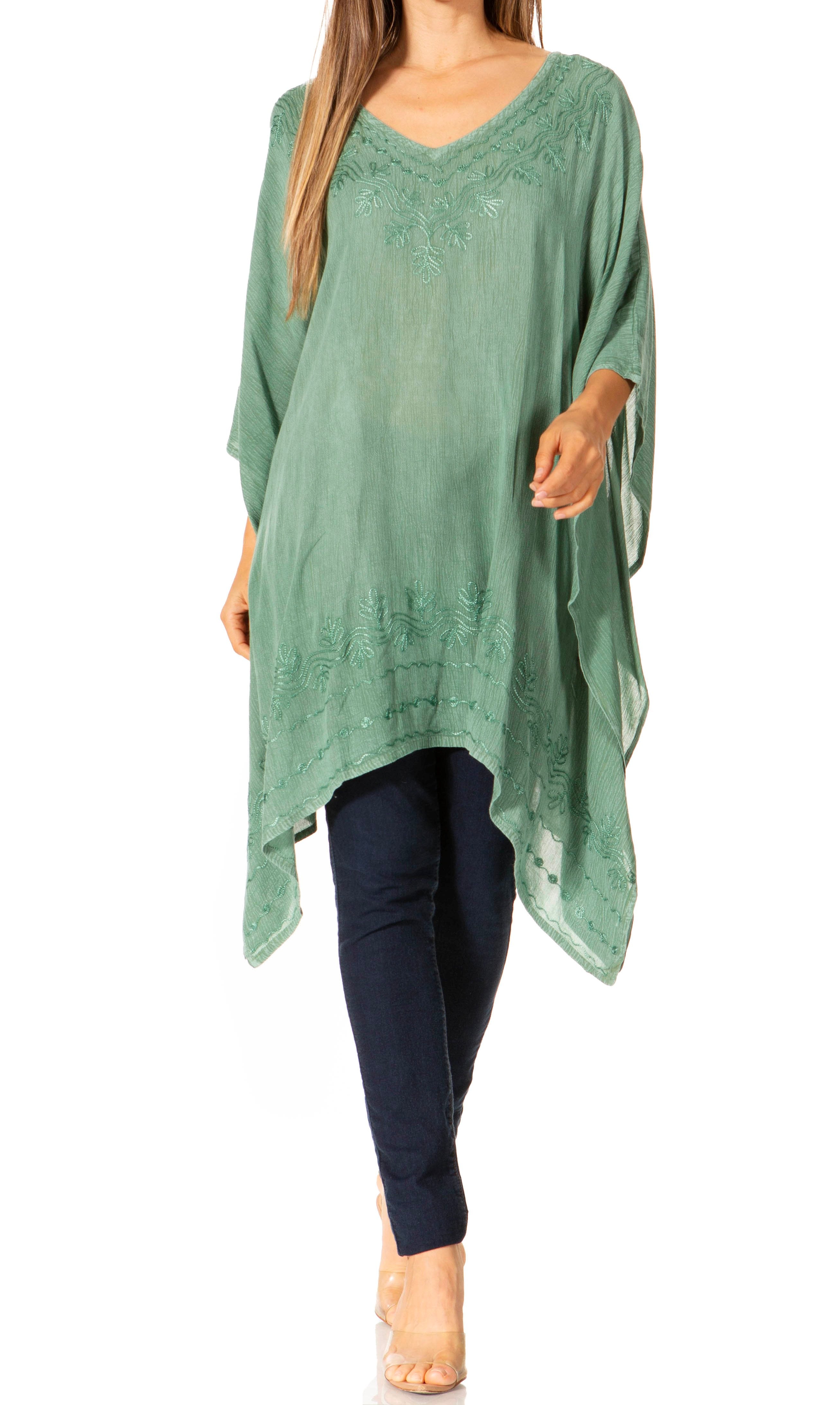 Green oversized top worn by a person on a white background