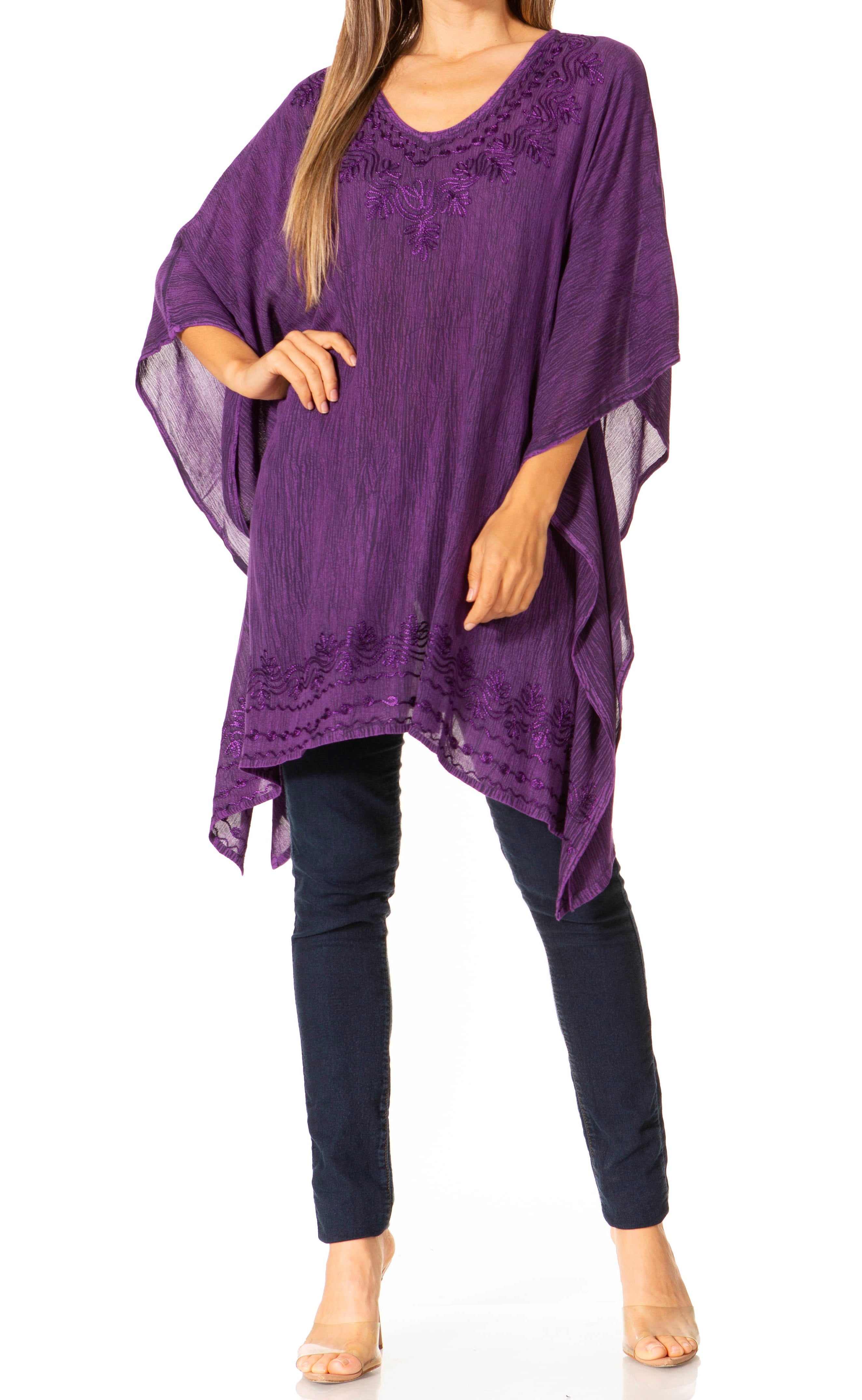 Purple poncho worn by a person on a white background